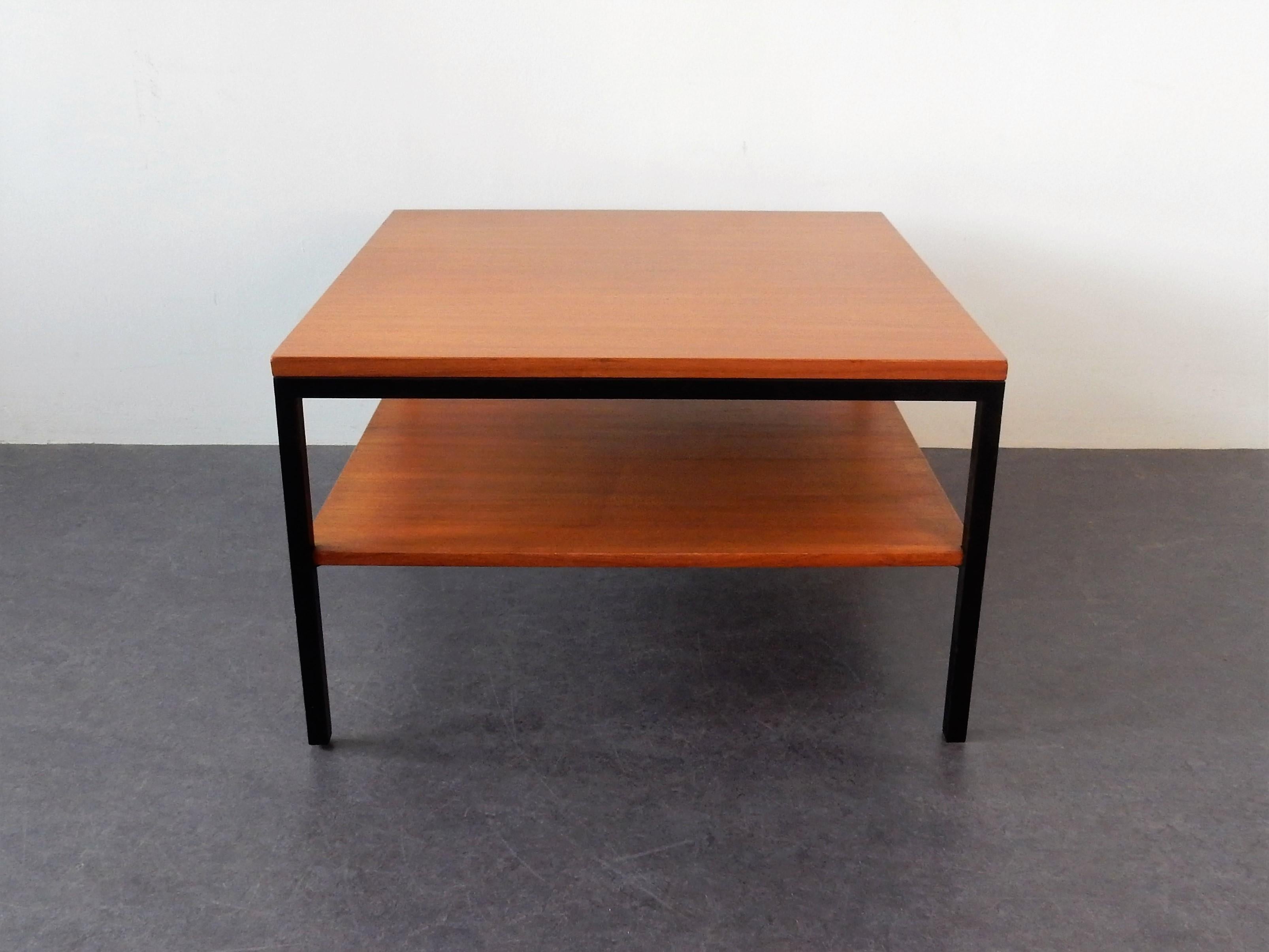 This is a very stylish wooden coffee table with a metal frame in the style of Pastoe. It has an extra low shelf to store your favorite magazines, tablet or other things. It has been professionally restored by our restorer and is in a very good