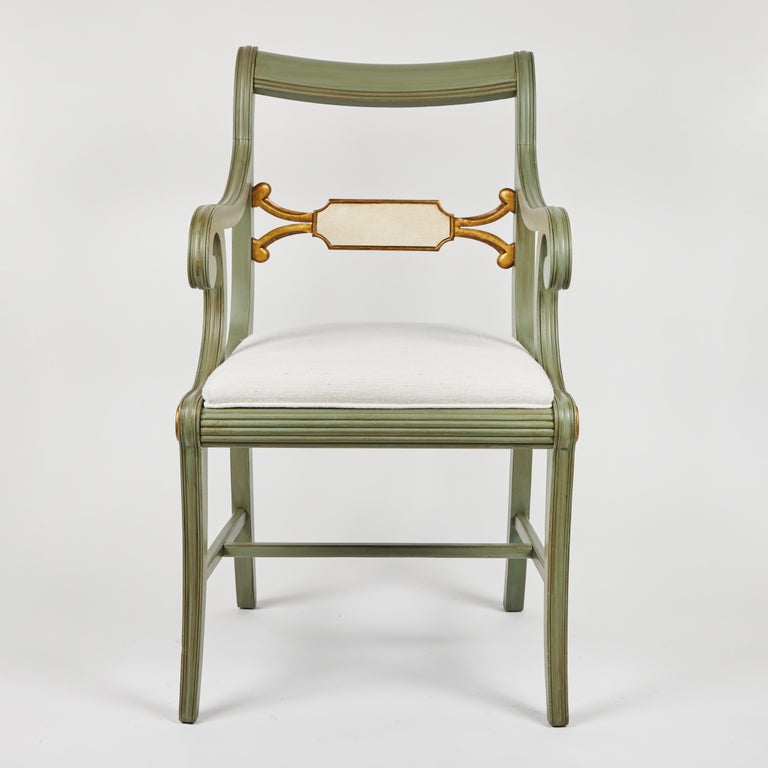 This outstanding vintage wood arm chair has been custom painted in the 'Swedish' style to highlight all its special details and the seat is newly upholstered in a beautiful vintage ivory linen.