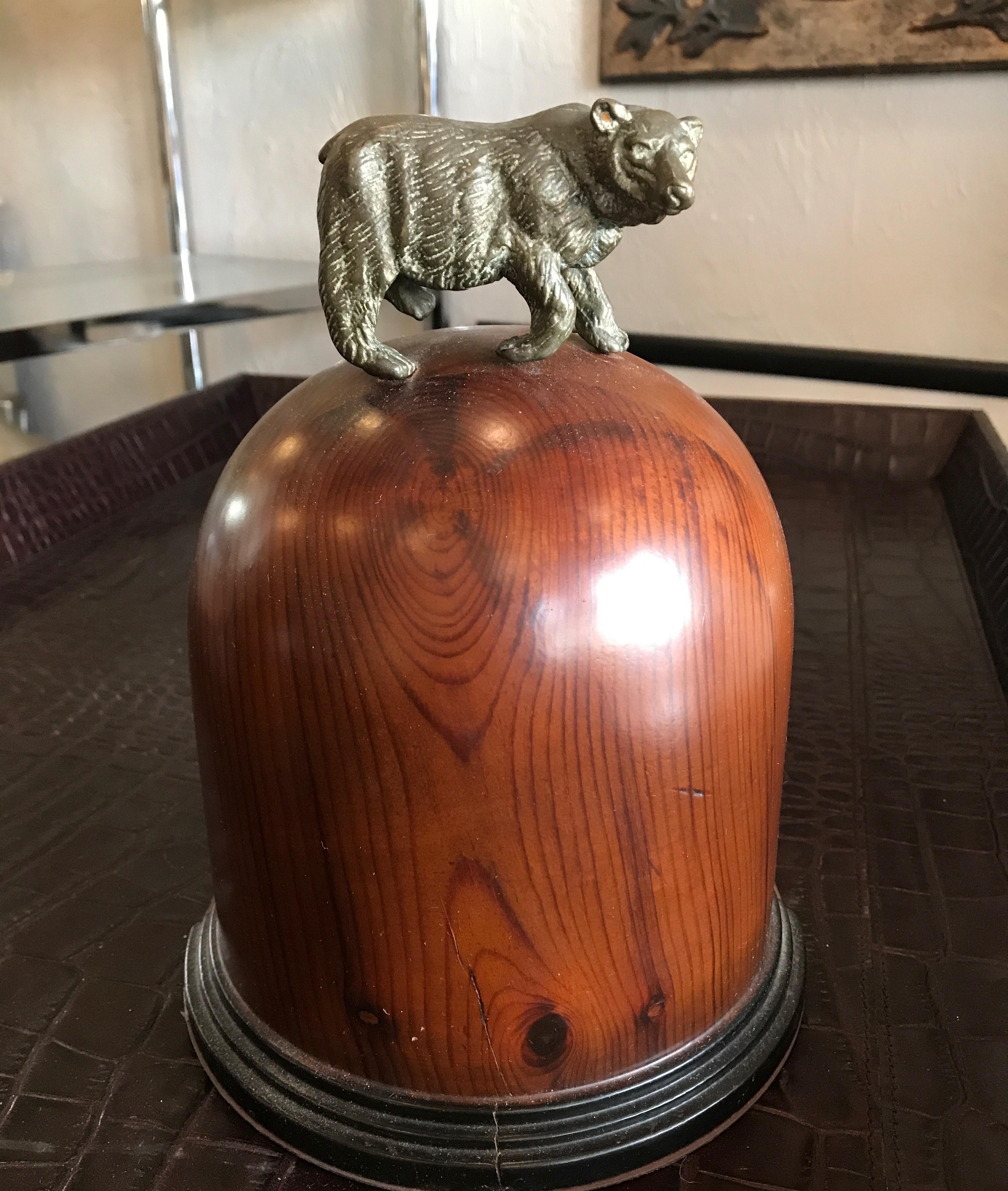 Large scale bull and bear bookends. Each bookend is a beautifully finished wood dome with a brass bear and bull mounted on top.