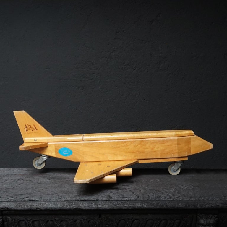 This is a hard-to-find-in-this-condition vintage 1970s wood cargo airplane made by Community Playthings of Robertsbridge, Sussex. 

This airplane has a full 29