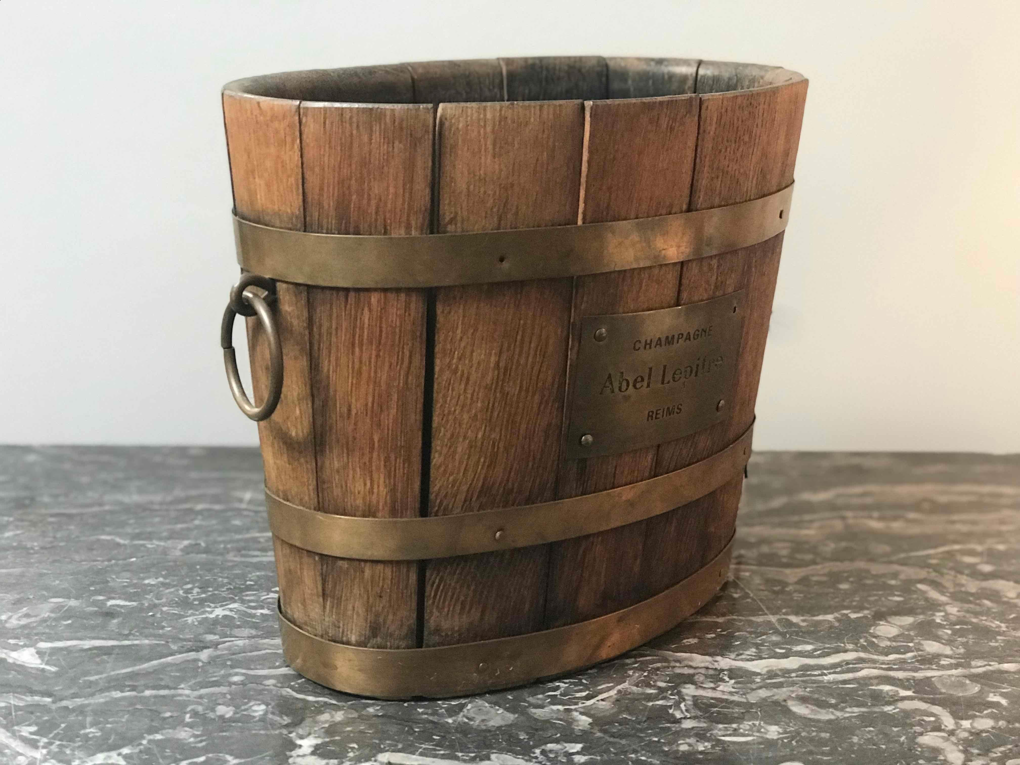 Vintage wood champagne bucket with brass label and handles from France.  