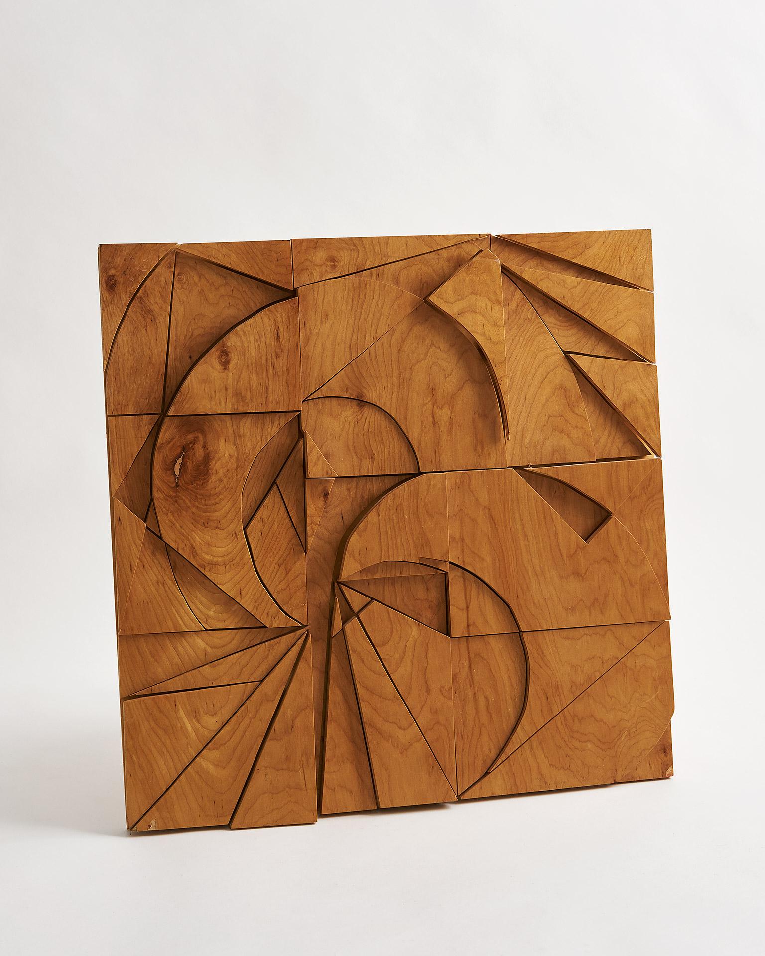 Vintage Brutalist layered geometric woodcut wall art with curved and diagonal lines. A unique wall sculpture that showcases dynamic woodworking. In very good vintage condition, shows age-appropriate wear.

This item is part of a vintage collection