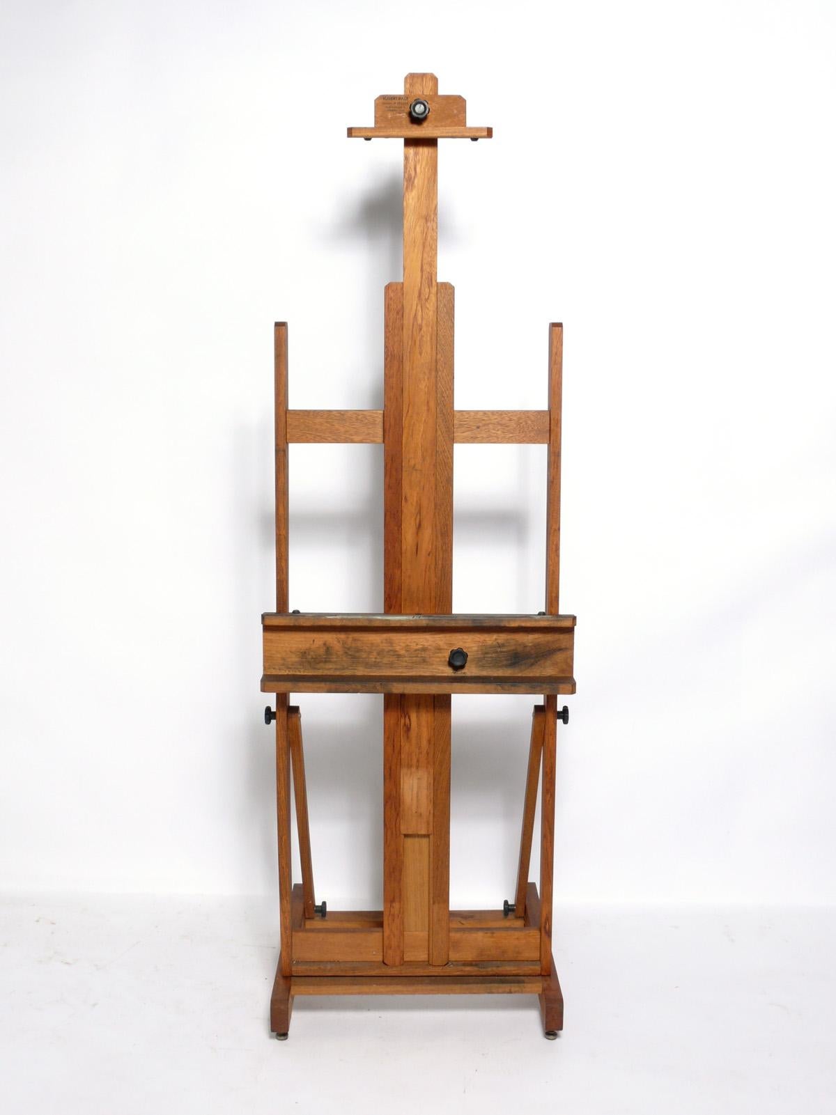 Vintage wood easel, American, circa 1990s. Can be used to display your favorite art or flat screen TV. It can extend to 97