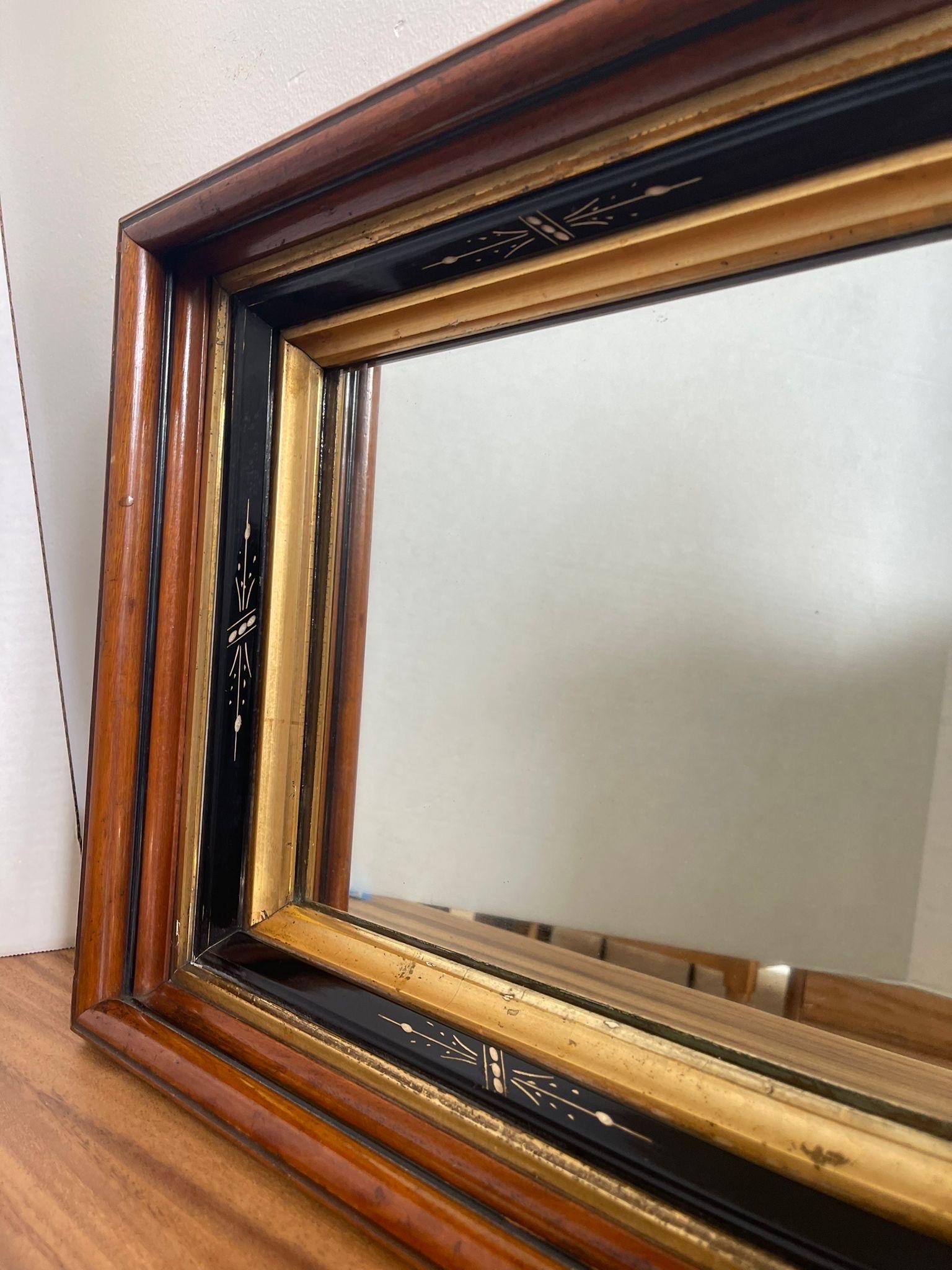 Mid-Century Modern Vintage Wood Framed Mirror With Gilt Wood and Hand Painted Accents. For Sale