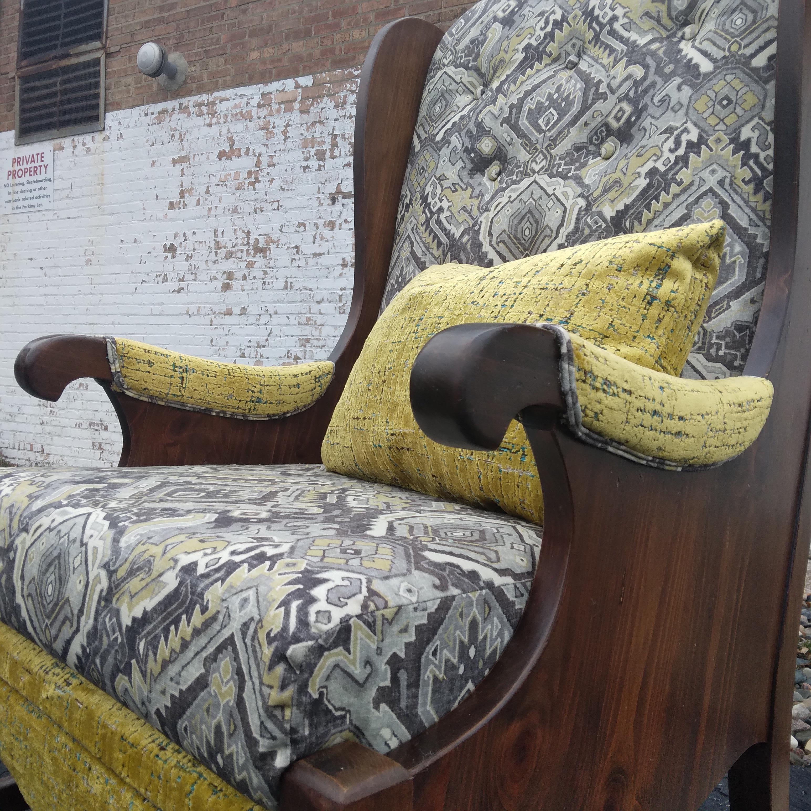 Bold and complex -- this vintage wingback is ready to steal the show. Splashes of vibrant yellow velvet add dimension to an otherwise neutral palette. We love the richness of her solid wood frame.  With all fresh foam, new webbing, and