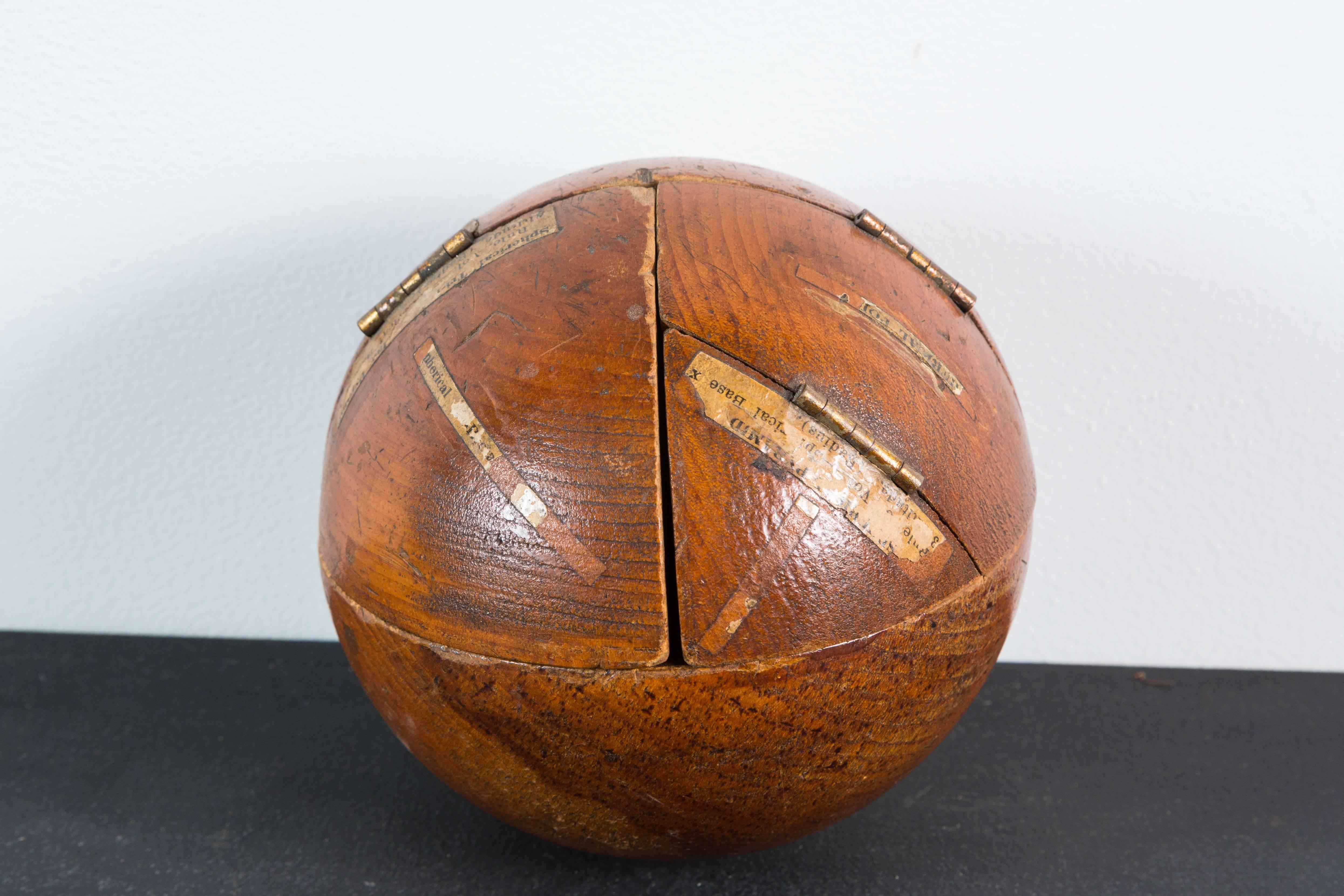 Fantastic multidimensional geometry teaching sphere. Wonderful warm patina to wood surface. Original notes displayed on the sphere and inside. Opens up to many different shapes and options.