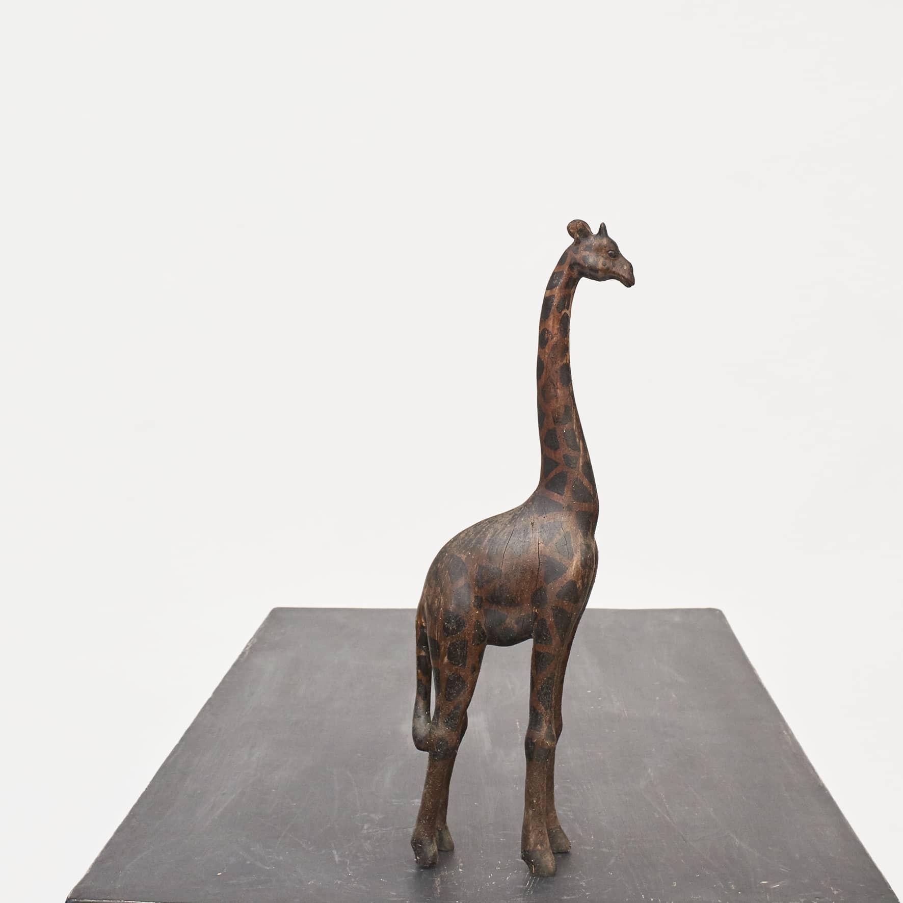 A charming vintage wooden giraffe. Hand-carved from hardwood (tropical wood) with brown and black painted surface.
From Africa, c. 50-100 years old.
In original vintage condition, with minor wear consistent with age and use.
Small chip on one ear.