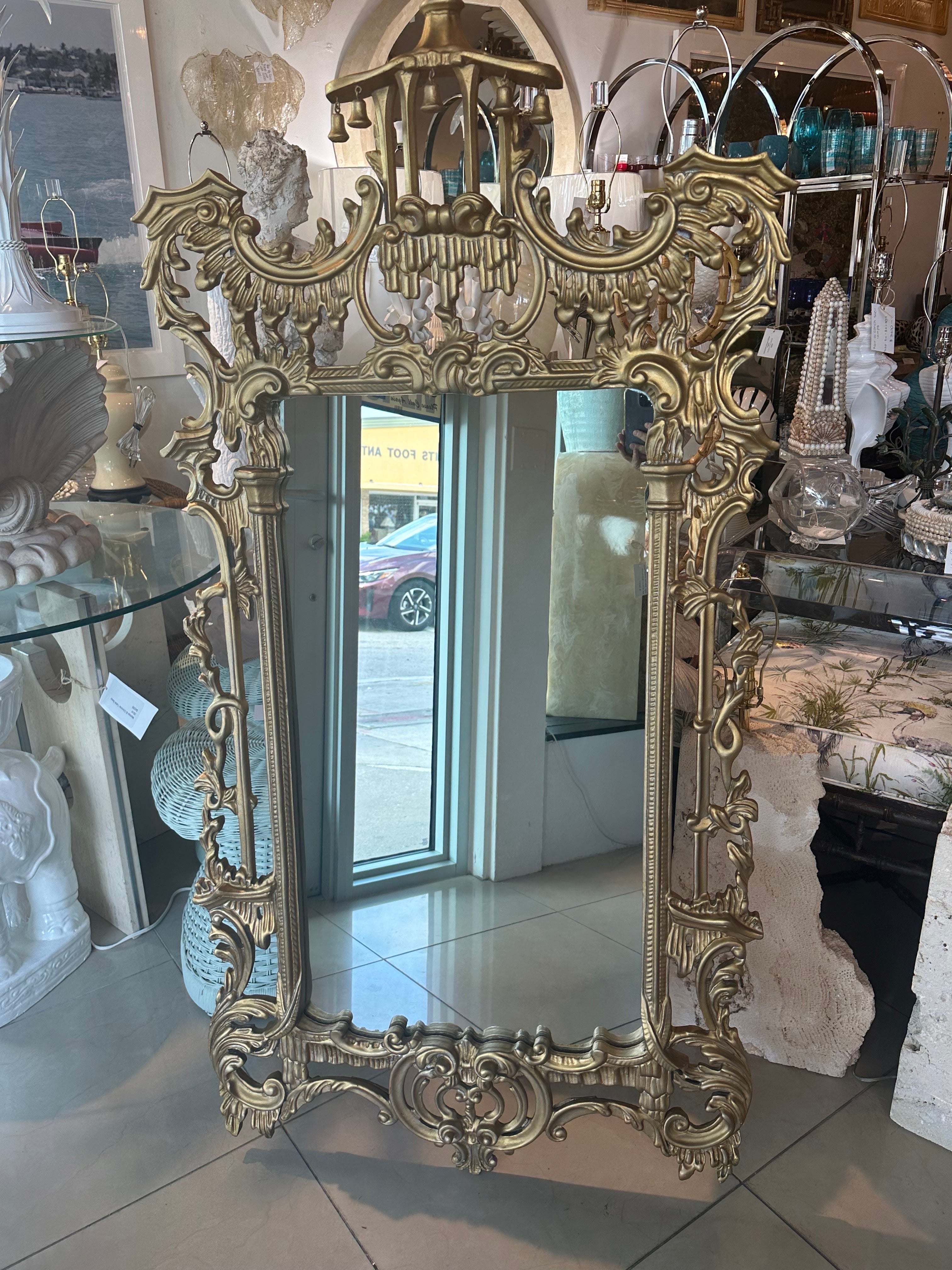Beautiful vintage Italian wood carved pagoda with bells gold gilt wall mirror. Comes ready to hang. Dimensions: 62.5 H x 31.5 W x 2.5 D. 