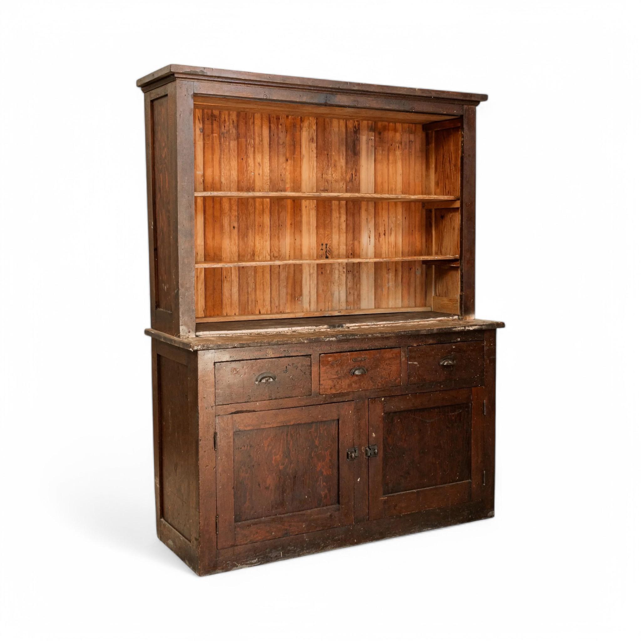 A rustic vintage wood hutch with a beautifully aged patina, featuring open shelving above for display and a lower cabinet with three drawers and two doors for concealed storage. Its timeworn character and rich wood grain make it a perfect addition