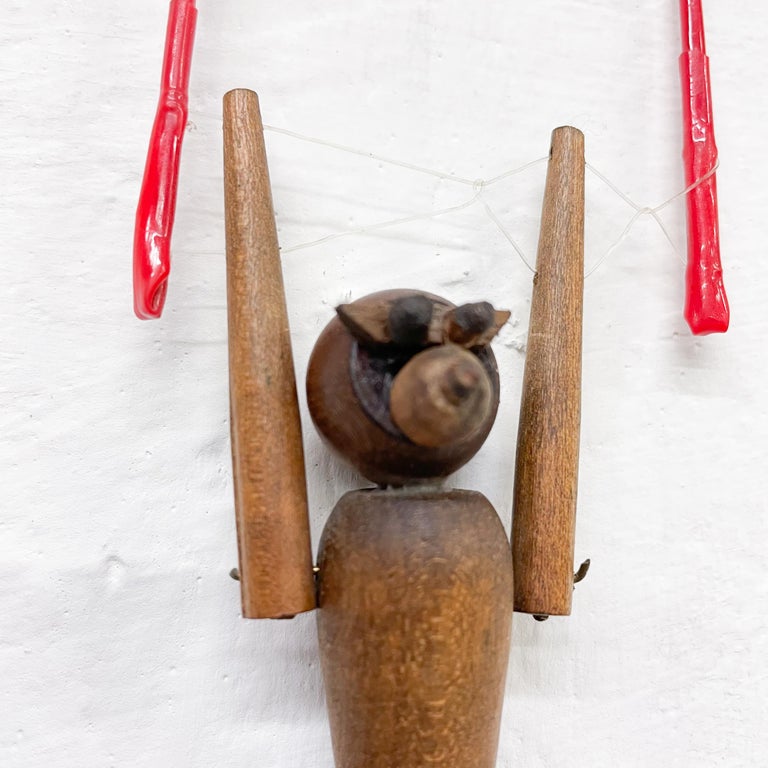 Mid-Century Modern vintage hanging toy wood work out monkey toy figure with articulating joints accompanied with hanging red plastic balance piece.
Unsigned. In the manner of Kay Bojesen era Denmark 1960s
Measures: 7 H x 2.5 W x 1 D, Monkey is