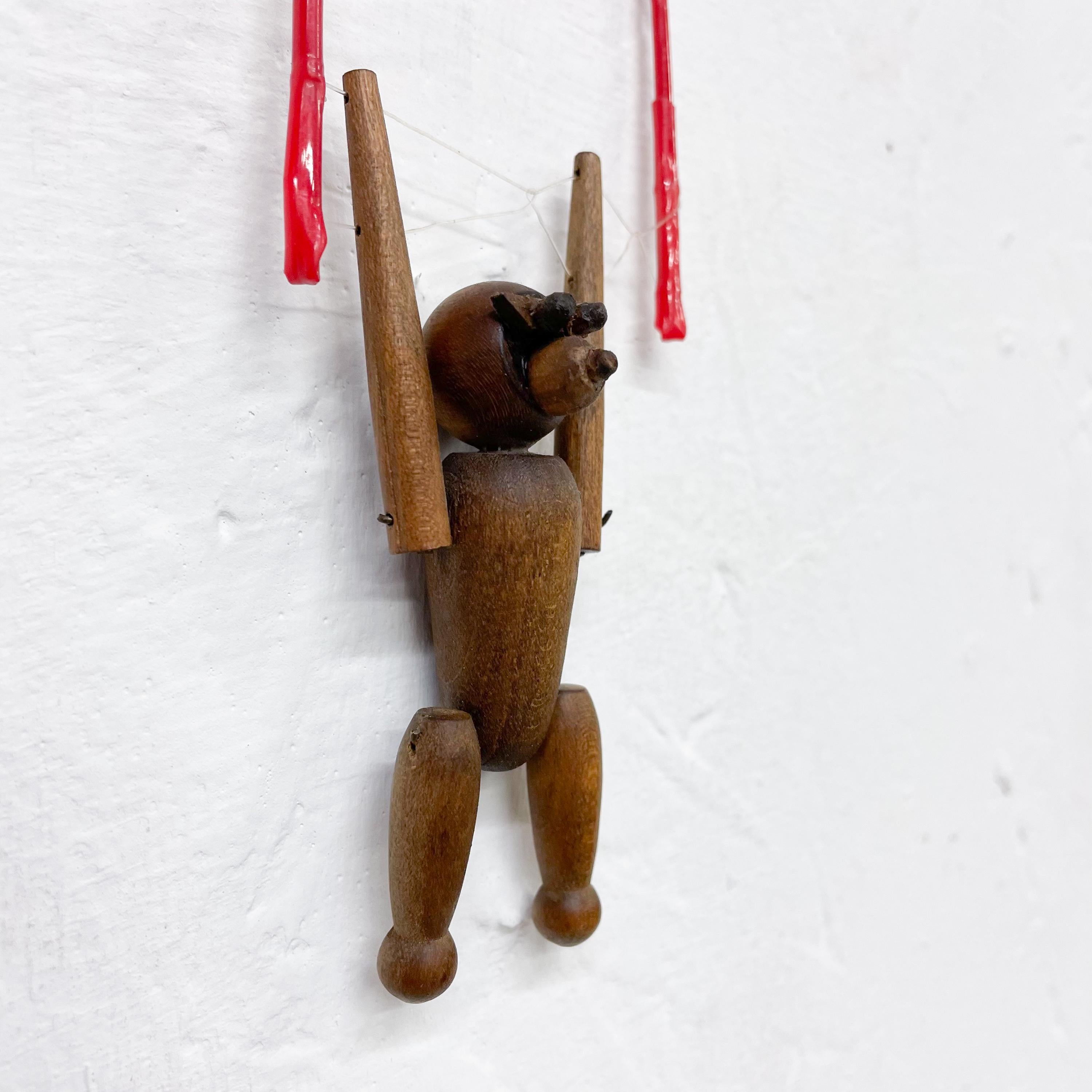 Scandinavian Modern 1960s Hanging Wood Monkey on Red Balance Rope 