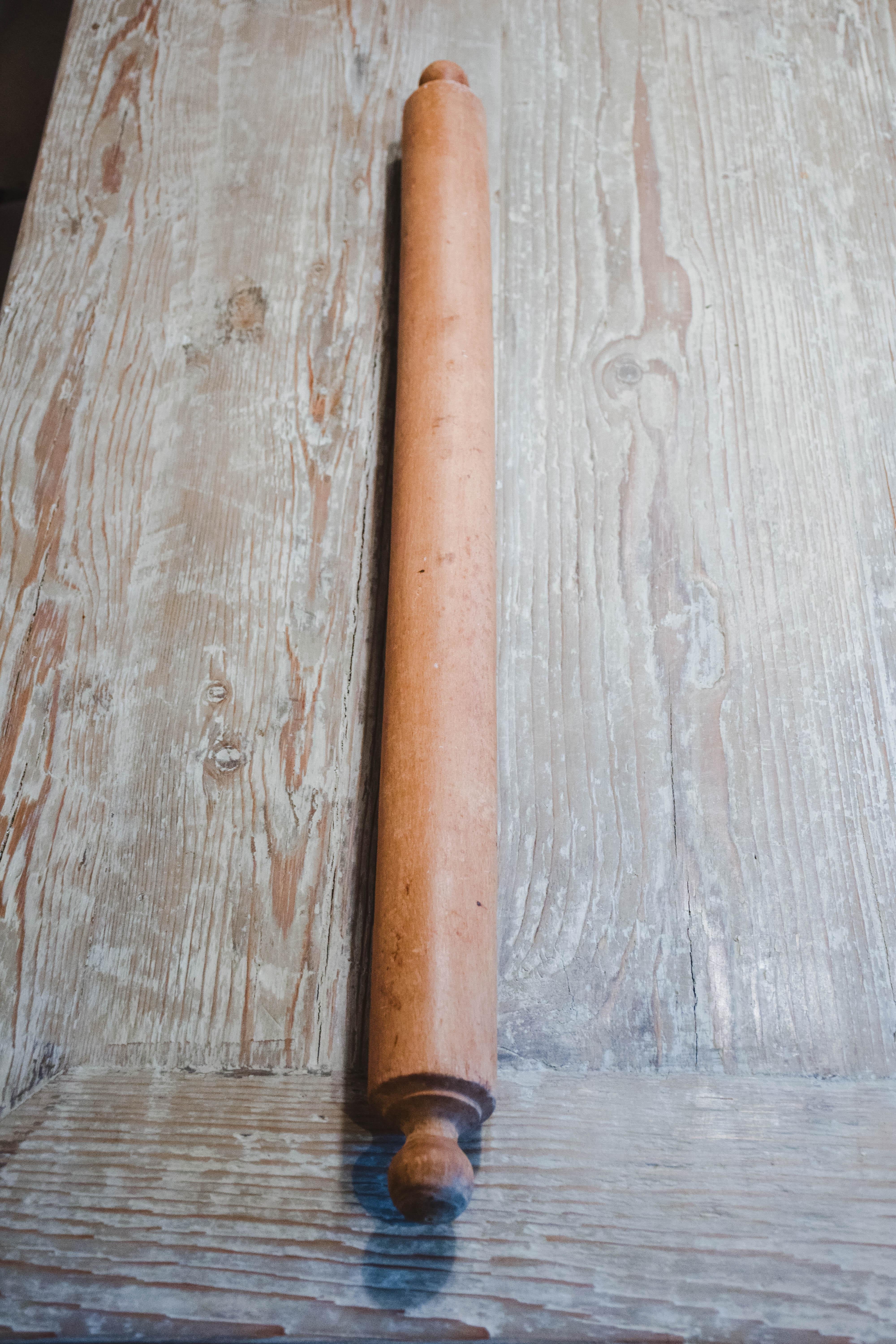 This vintage rolling pin was likely used to make cookies, pies or pasta. The wood pin is in good condition and has a nice patina.