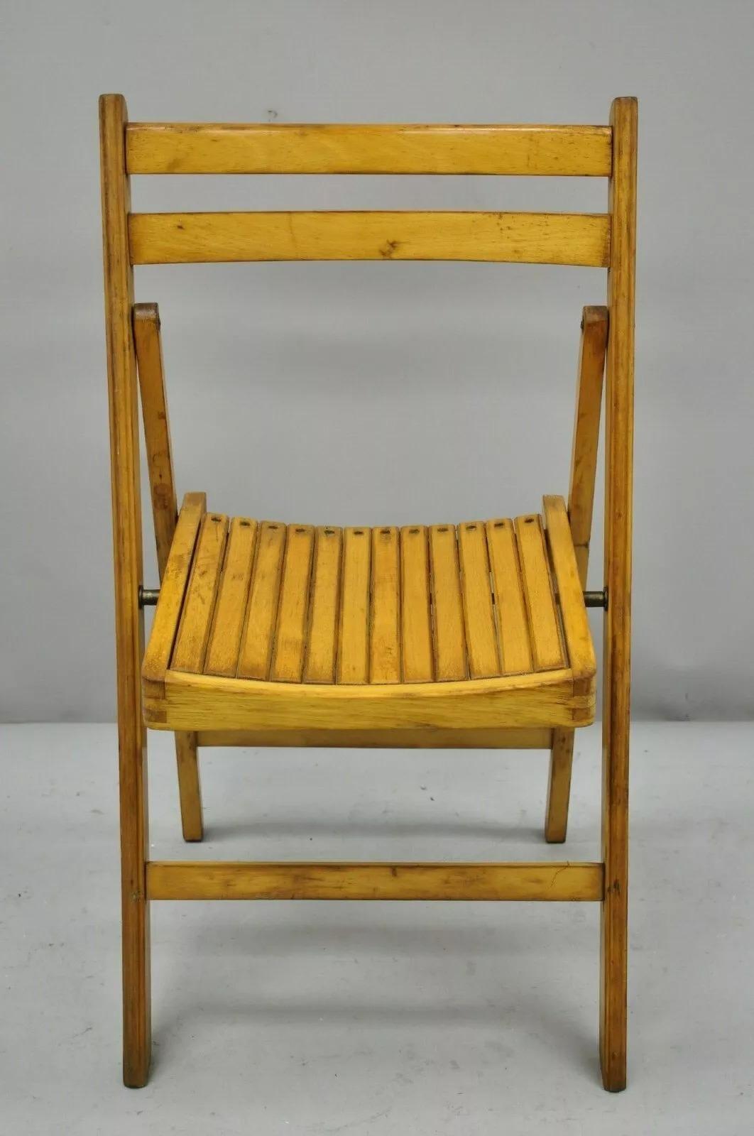 Vintage Wood Slat Seat Mid Century Modern Folding Dining Game Chair. Item features wood slat seat, solid wood construction, beautiful wood grain, very nice vintage item, quality American craftsmanship. Circa Mid 20th Century. Measurements: 33