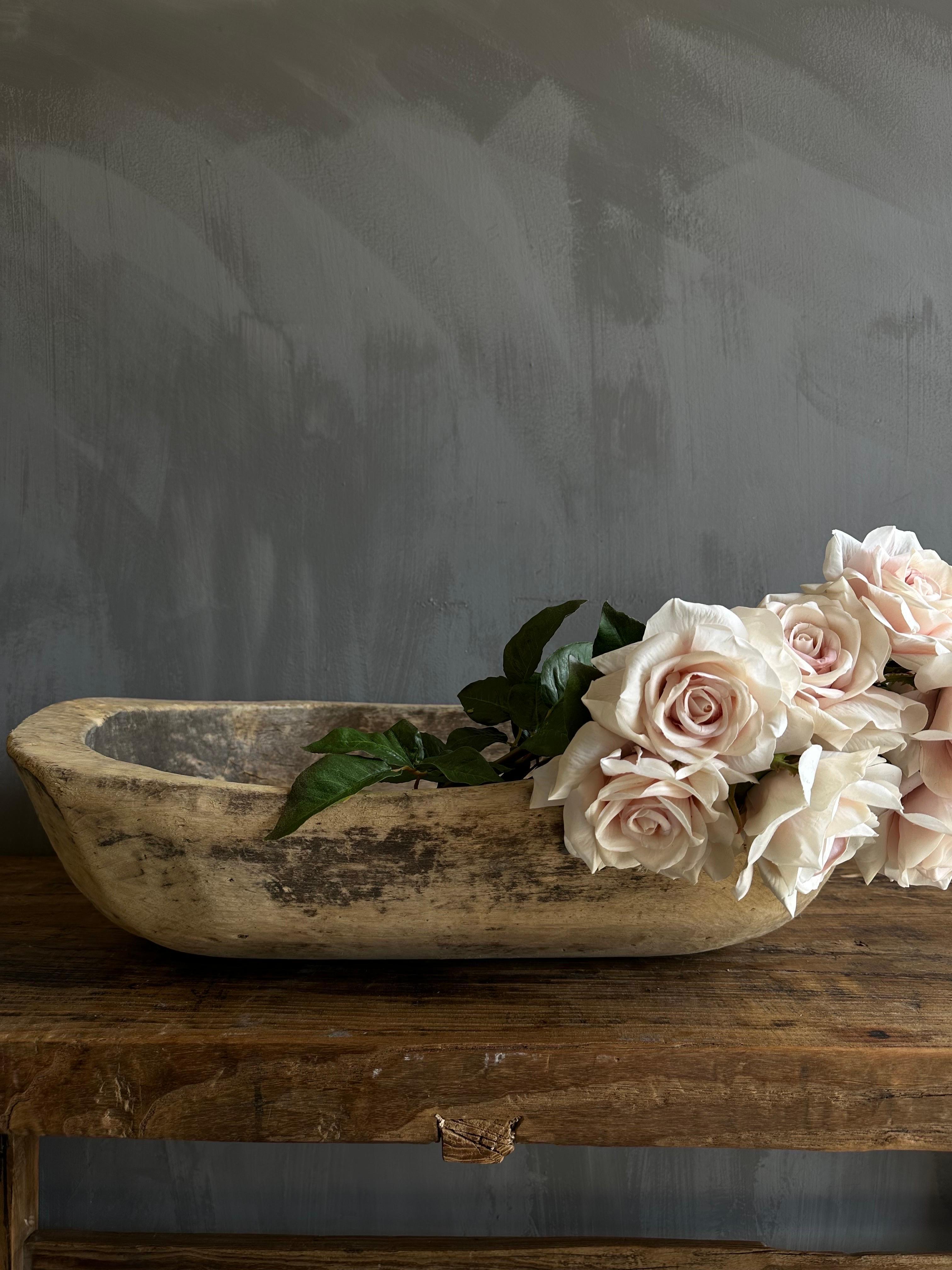 Vintage Wood Trough Decorative Bowl
A beautiful wood trough with a natural patina. Can be used on a dining table or server for decoration.
Wood is natural with patina. Some troughs will have decorative metal on or around the bowl, please view the
