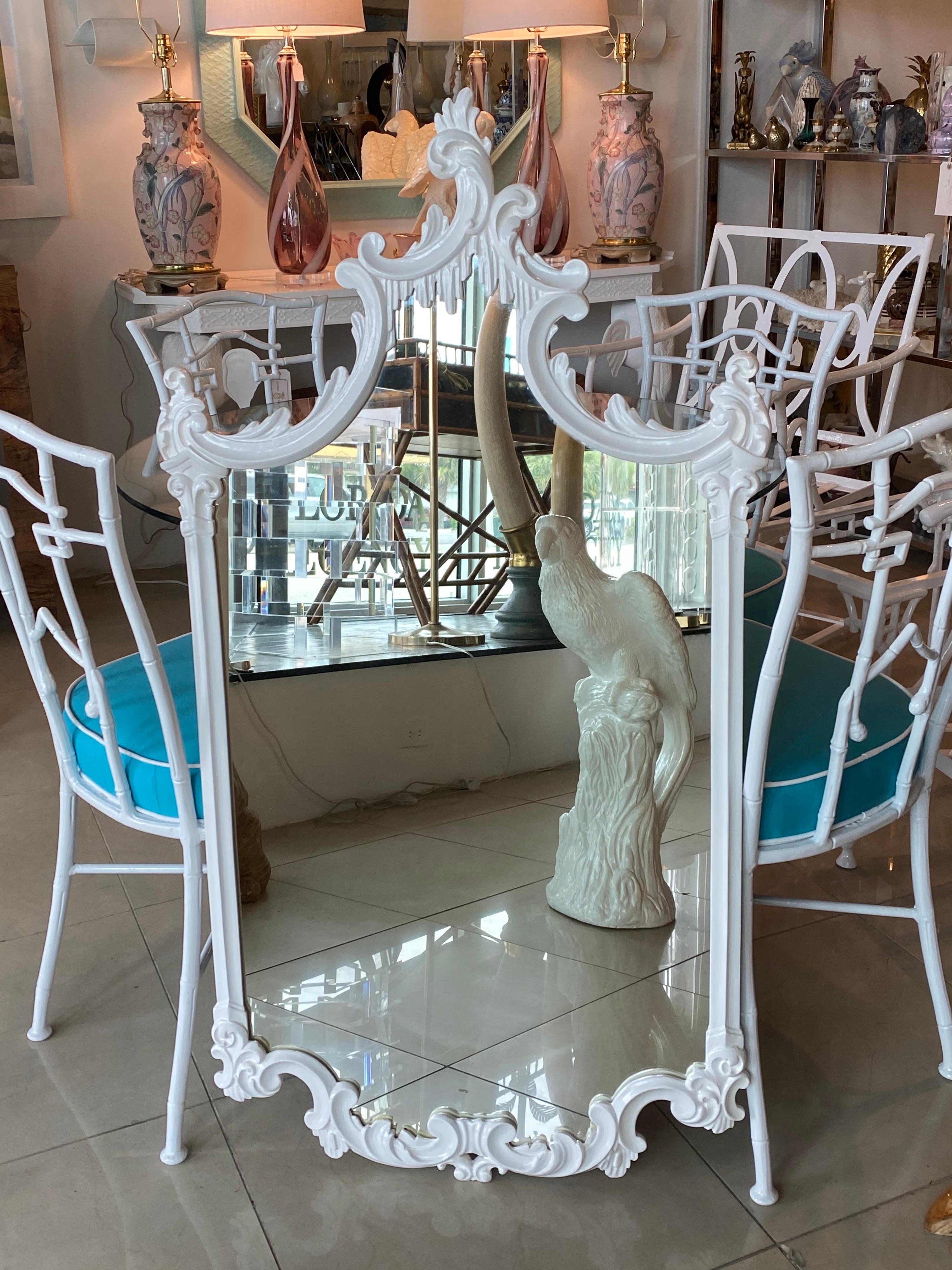 Lovely vintage wood pagoda wall mirror. Lovely details that drip down on the top pagoda portion. Newly lacquered in a fresh, clean white. Comes ready to hang.