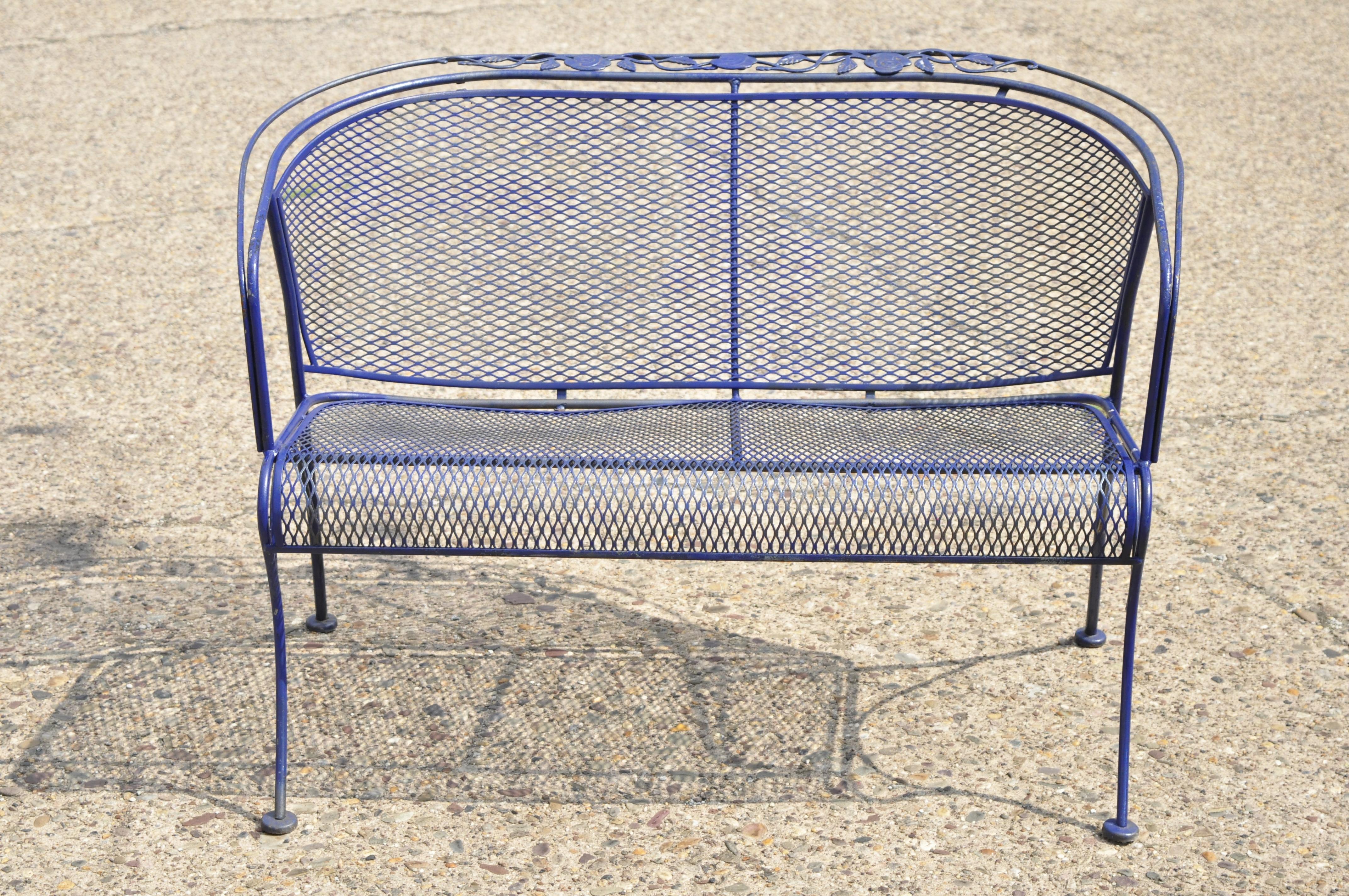 Vintage Woodard blue barrel back wrought iron rose pattern garden patio bench. Item features mesh back and seat, wrought iron construction, quality American craftsmanship, great style and form, circa mid-late 20th century. Measurements: 30