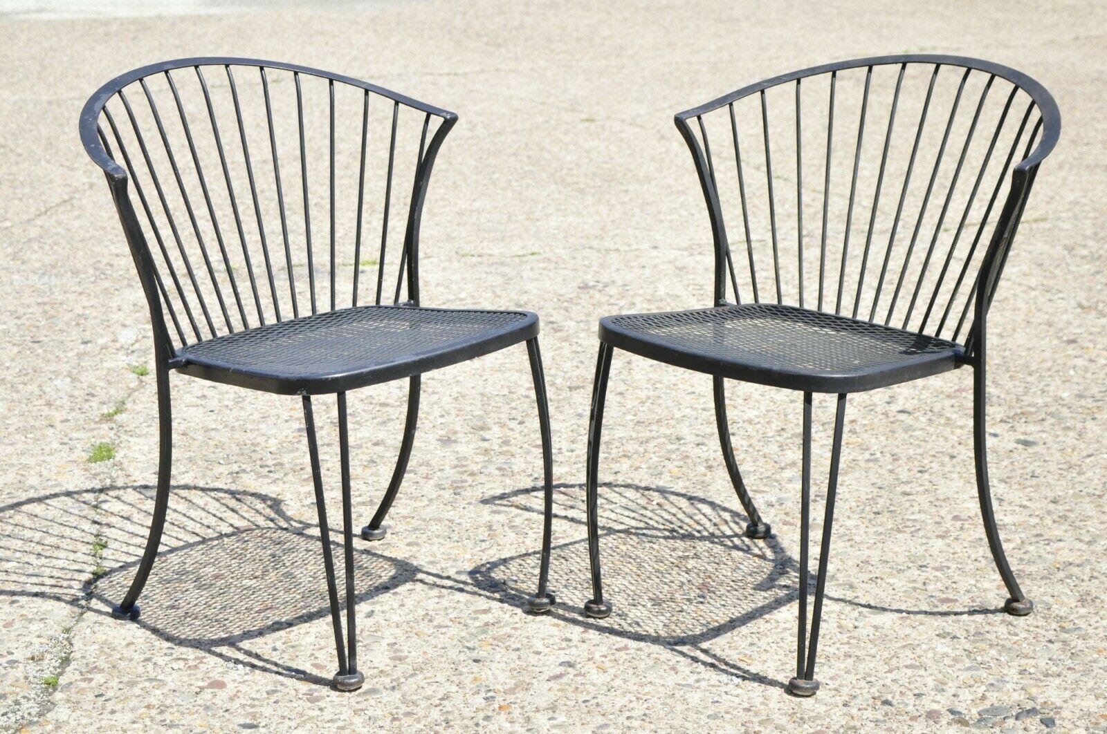 Vintage woodard pinecrest style wrought iron garden patio dining chairs - set of 4. Item features (4) dining chairs, wrought iron frames, curved barrel backs, perforated metal mesh seat and back. Unmarked, possibly by Woodard. Circa mid to late 20th