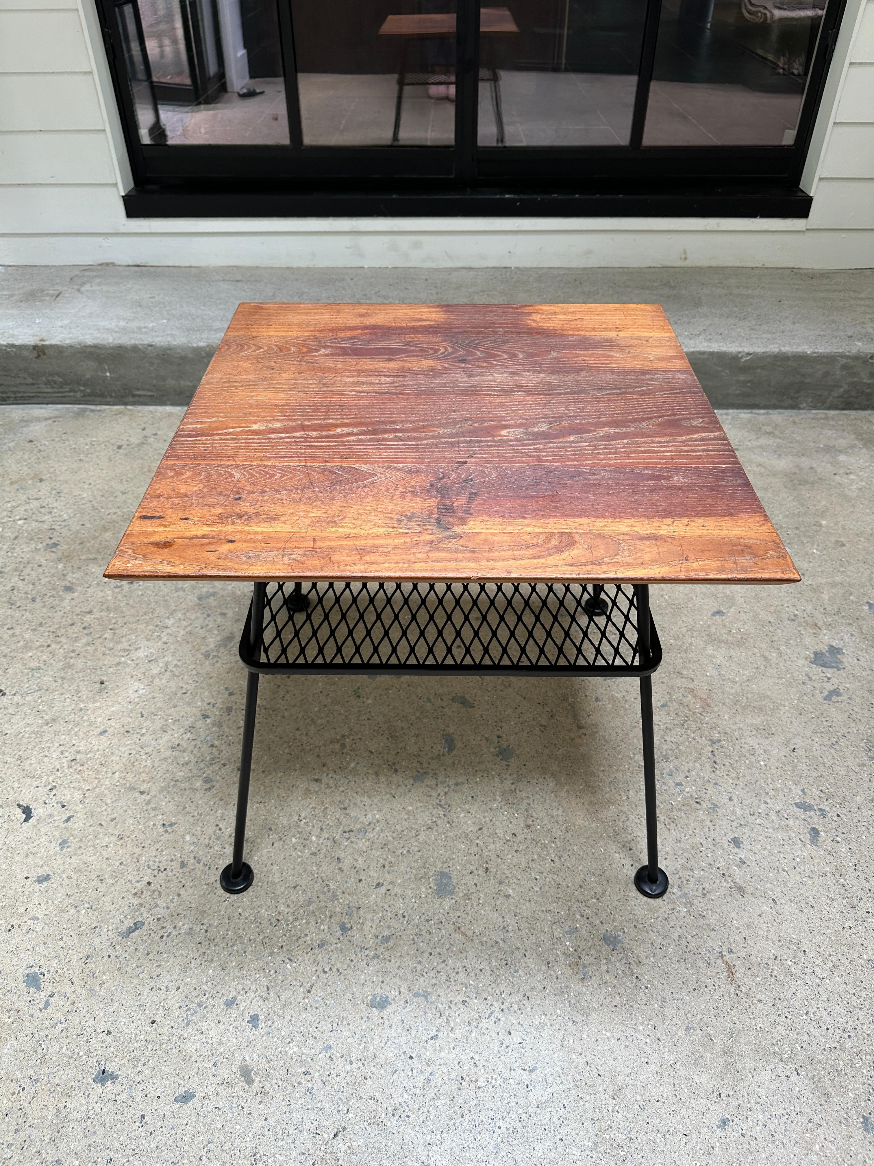 Rare and seldom seen Sculptura side table by Russell Woodard. Impeccable condition with base coated in matte black and top featuring a vintage patina that makes this piece even more unique.

24”W x 24”D x 22”H