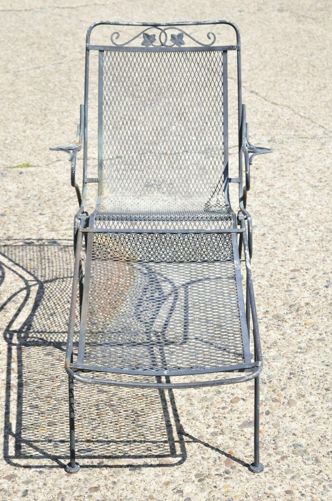 Vintage Woodard Wrought Iron Garden Patio Lounge Chair with Removable Ottoman. Item features wrought iron frame, removable footrest ottoman, perforated mesh seat and back, 2 part construction, very nice vintage set, quality American craftsmanship,