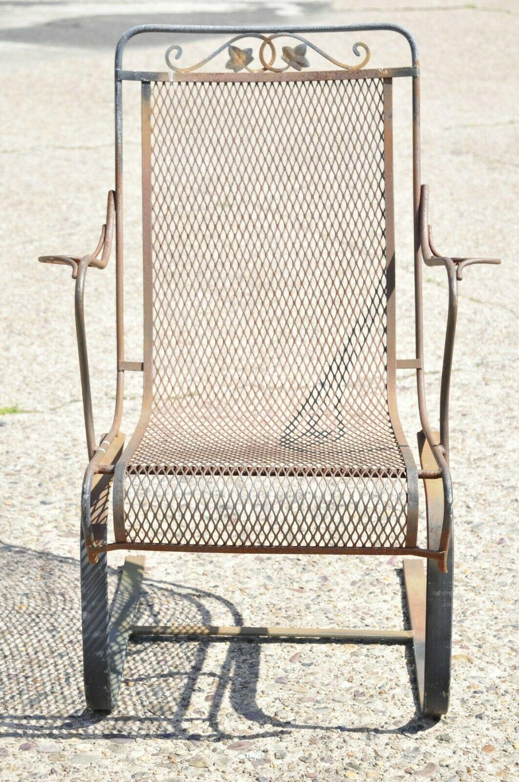 Vintage Woodard Wrought Iron Maple Leaf Garden Patio Bouncer Spring Chair. Item features iron and steel frame, mesh seat, maple leaf and vine design, very nice vintage item, quality American craftsmanship. Circa Mid 20th Century. Measurements: 38
