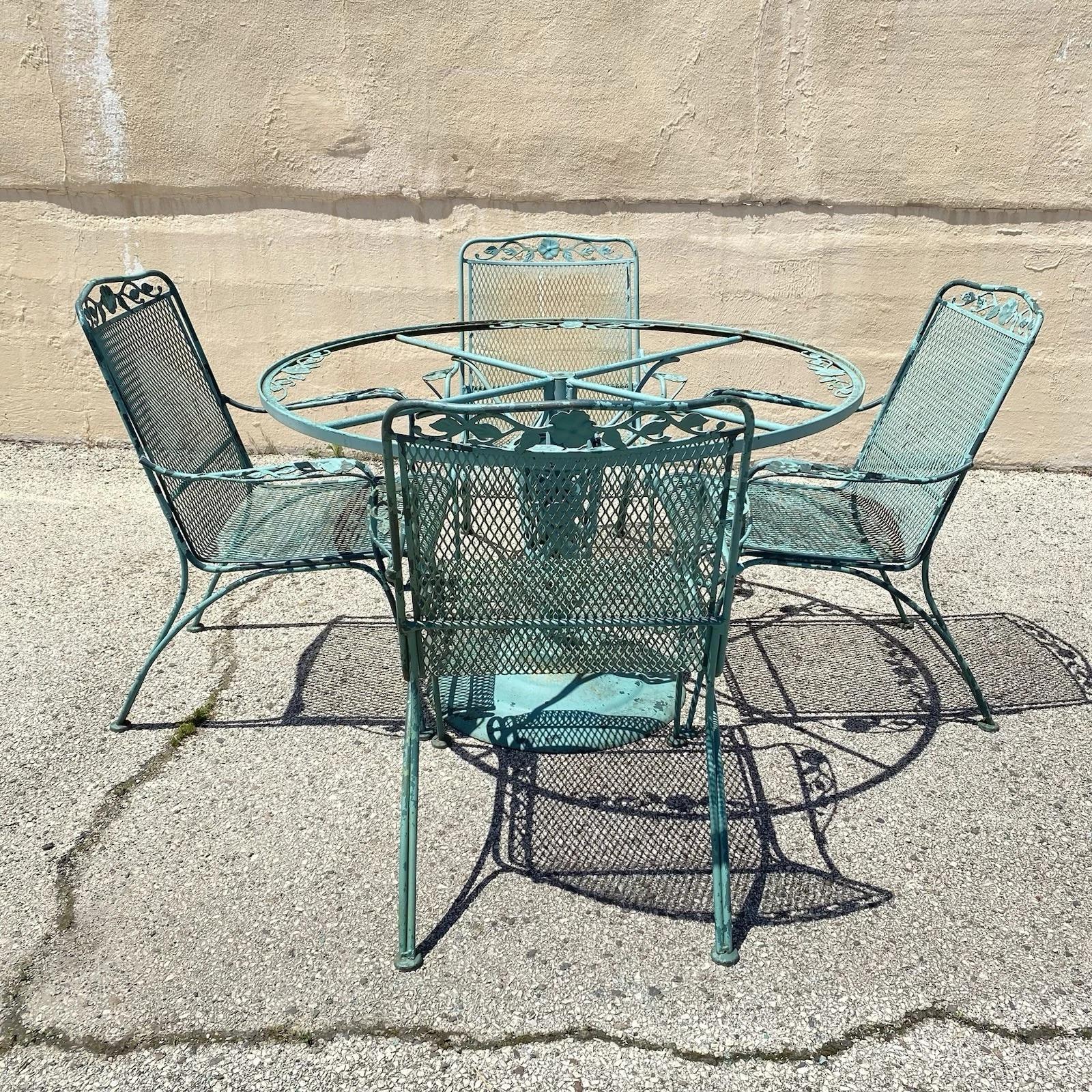 Vintage Woodard Wrought Iron Patio Dining Set with Round Pedestal Base Dining Table (No glass) & 4 Dining Armchairs all with Flower and Vine Details - 5 Pc Set. Circa Late 20th Century. Measurements: Table (No glass): 29.25