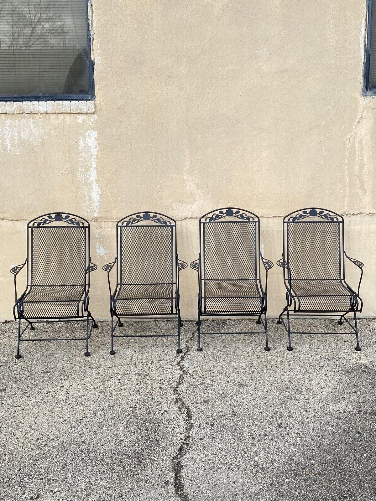 Vintage Woodard Wrought Iron Rose Pattern Springer Patio Arm Chairs - Set of 4. Circa Late 20th to Early 21st Century. Measurements: 39.5