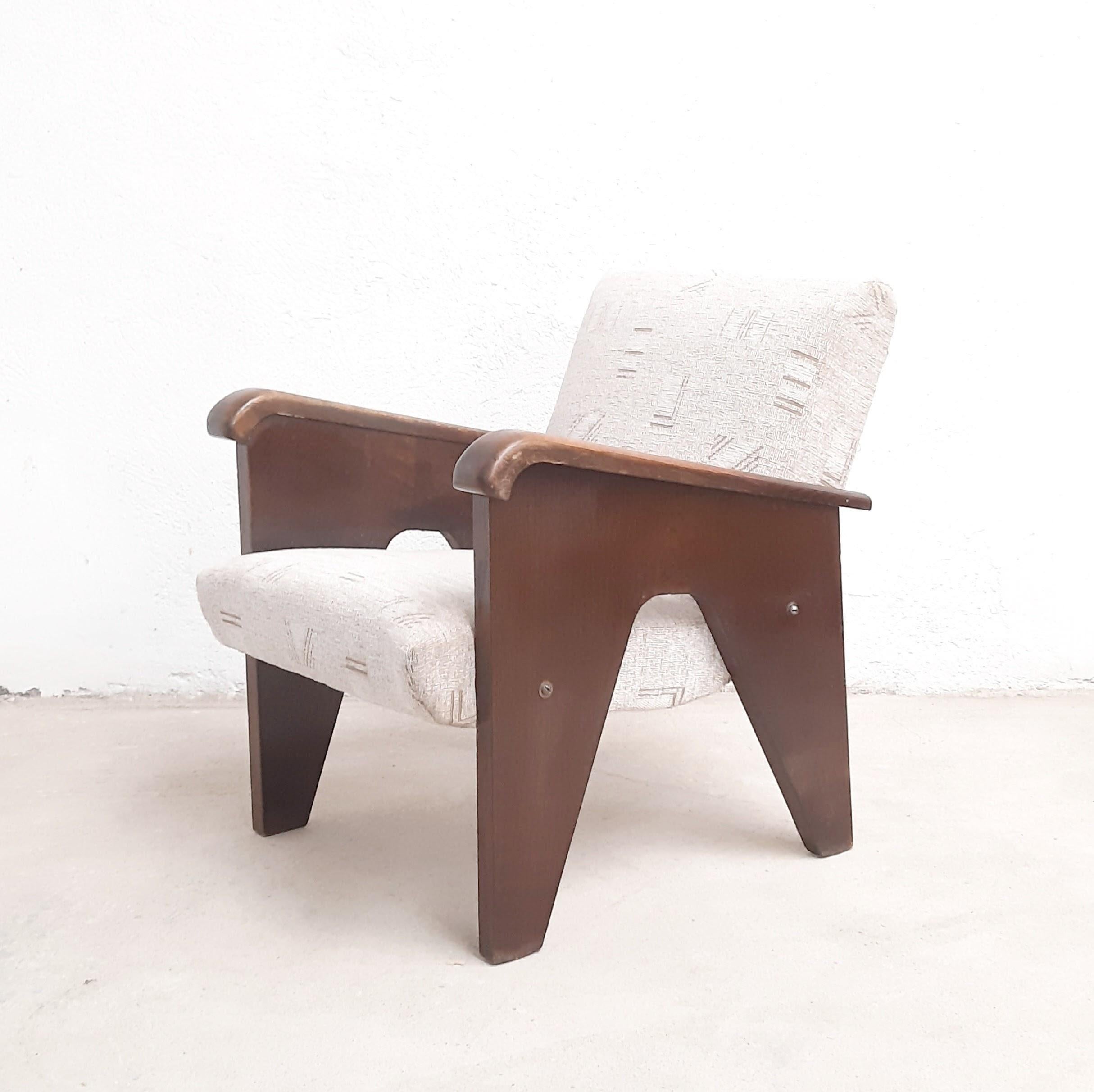 Unique armchair manufactured by UP Závody, home to famous Czech architect Jindrich Halabala, in late 40s / early 50s. Design attributed to Jan Vanek. Wooden structure in good original condition, previously reupholstered.