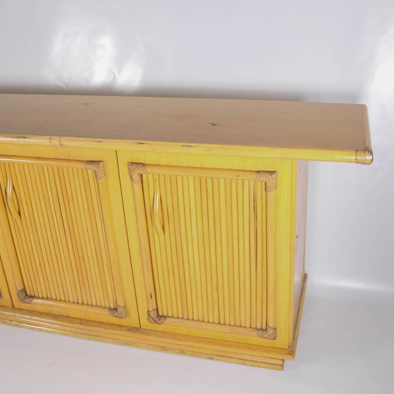 Vintage wooden and rattan credenza.