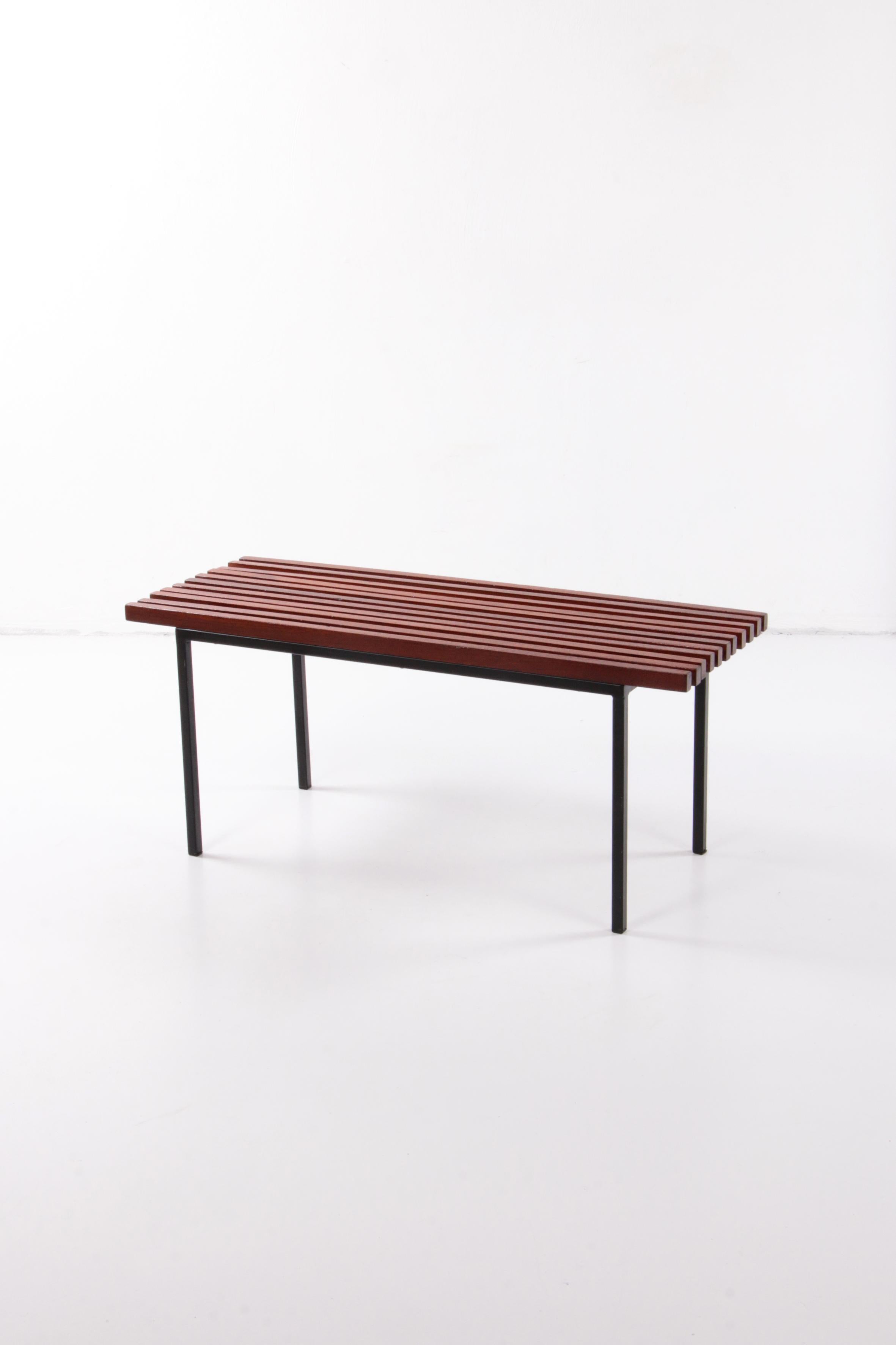 Vintage wooden bench in the style of Charlotte Perriand, 1960s.

This is a beautiful metal and wooden bench from France around the 1960s. It has a beautiful black base with a wooden slatted seat.

Very nice under your coat rack to place your