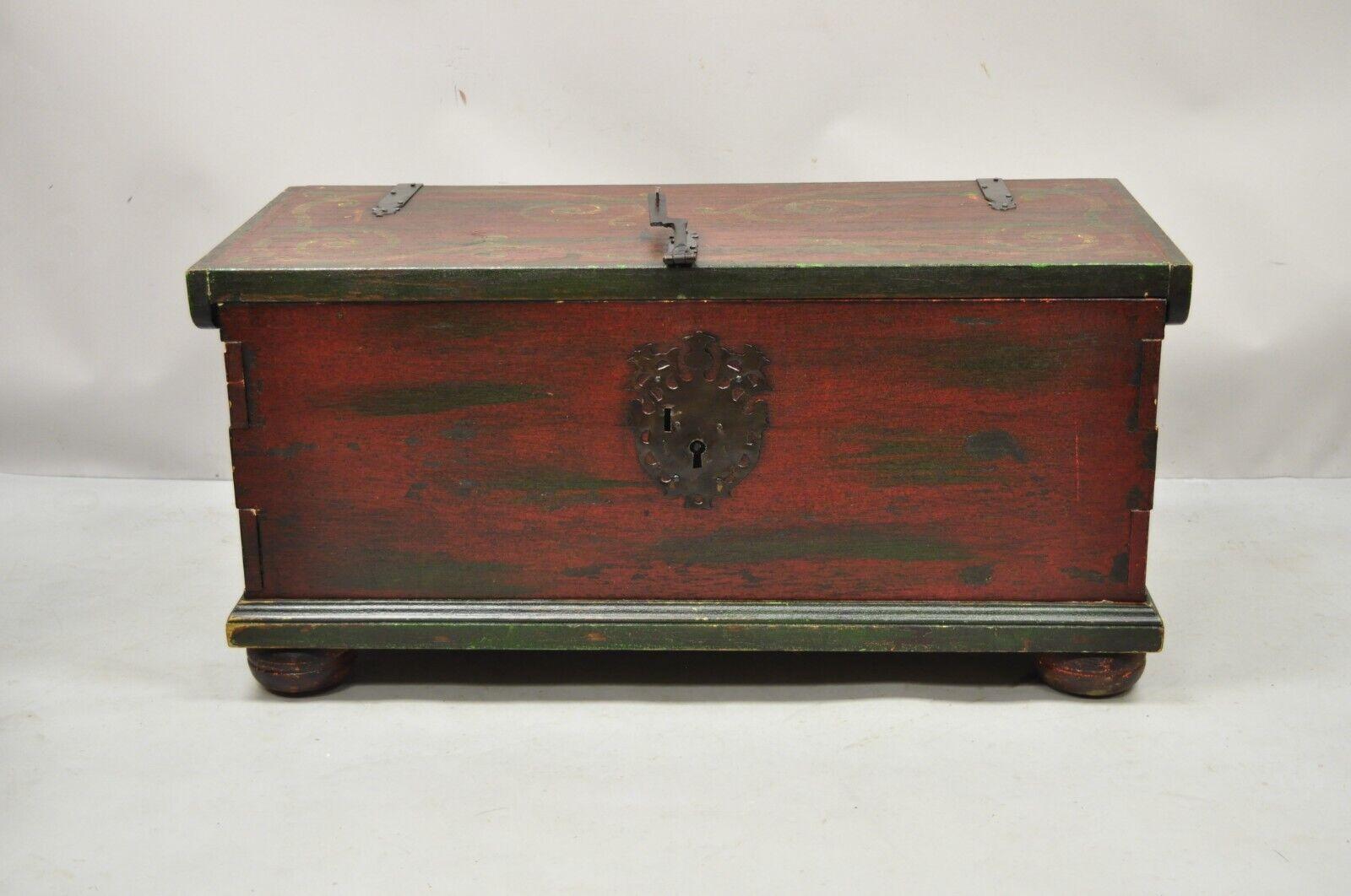 Vintage wooden blanket chest trunk French country style red green paint. Item features bun feet, green and red distress painted finish, dovetail joints, solid wood construction, original label, very nice vintage item. Circa mid to late 20th century.