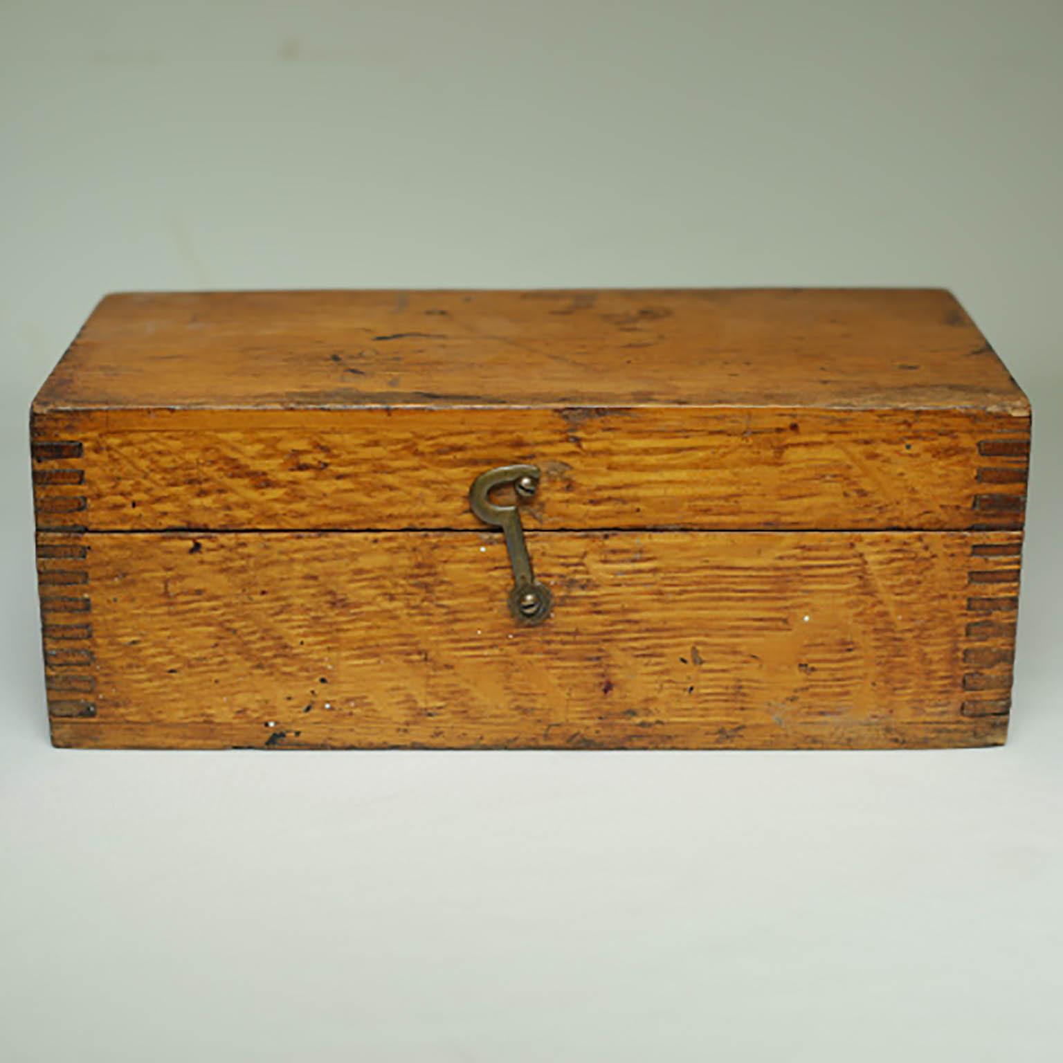 Wooden box with dovetail joints and latch.