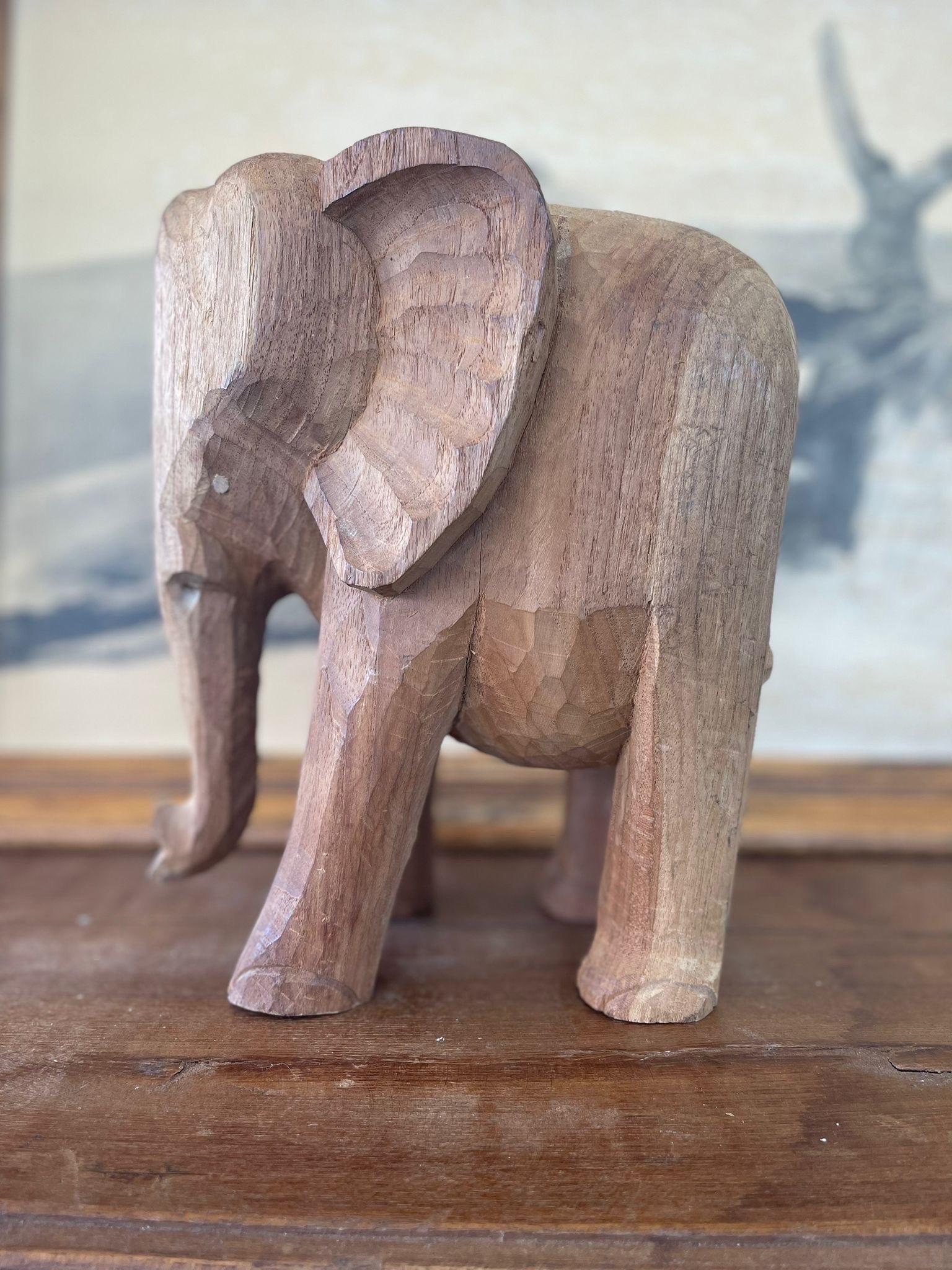 Antique Style Elephant Carving. Wear and Cracking Consistent With Age. Could be Used as Plant Stand.

Dimensions. 9 W ; 7 D ; 11 H