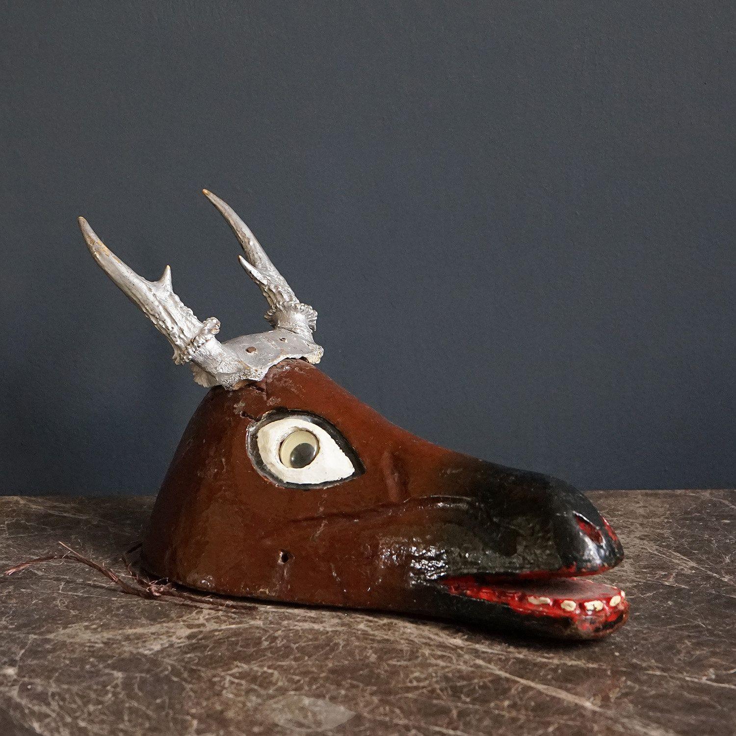 Vintage Wooden Deer Head With Antlers

Hand-carved and polychrome painted with silver antlers, googly eyes and a wonderful smile.

Provenance: Previously with Christies from the collection of Hollywood actress Brooke Haywood, along with her husband