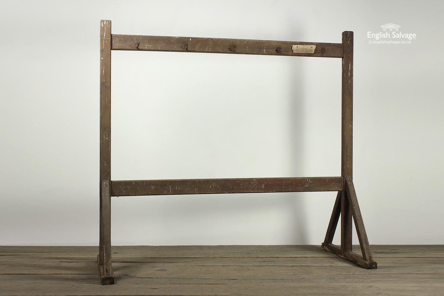 Vintage simple wooden coat stand on trestle like or gallow style legs and hooks either side. An ideal addition to any entrance hallway, big enough for the whole family to use, hooks could also be added to the bottom bar.

Slight wobble on base!