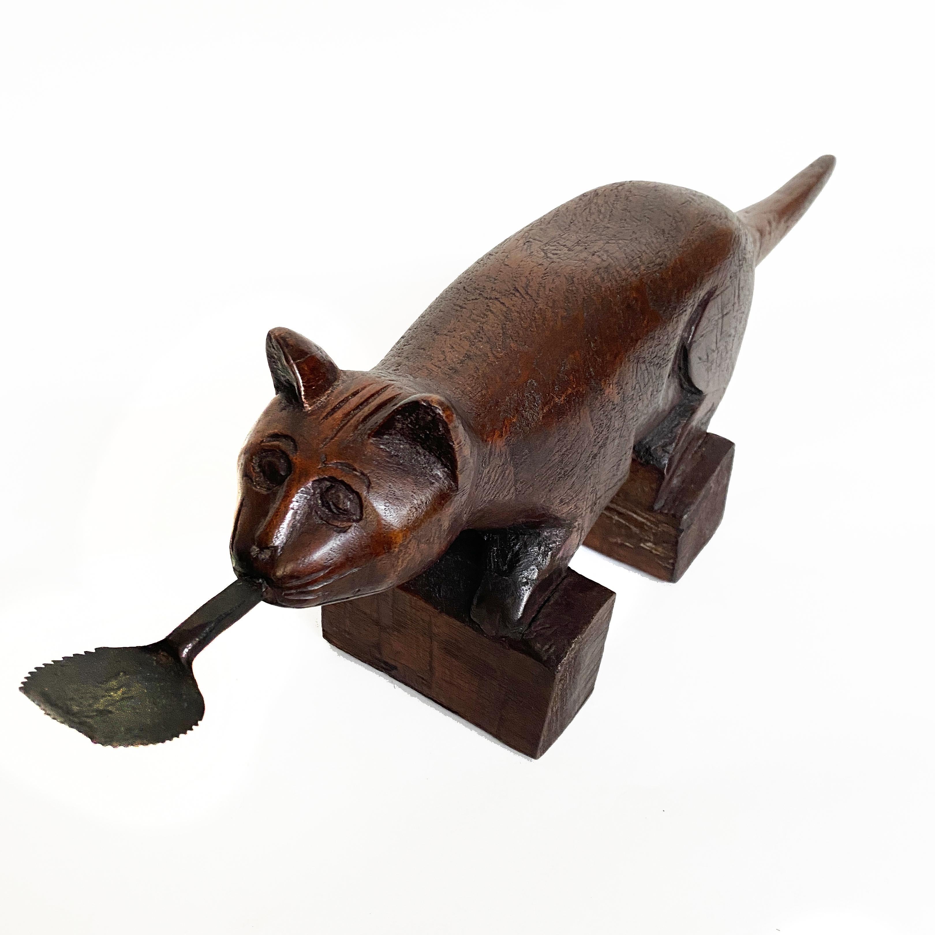 Vintage Wooden Coconut Grater in Animal Form, Thailand

A utilitarian implement commonly used in an Asian household.  To use it, the coconut is cut in half, with one of the halves placed against the blade and slowly rotated.  The patina of the wood