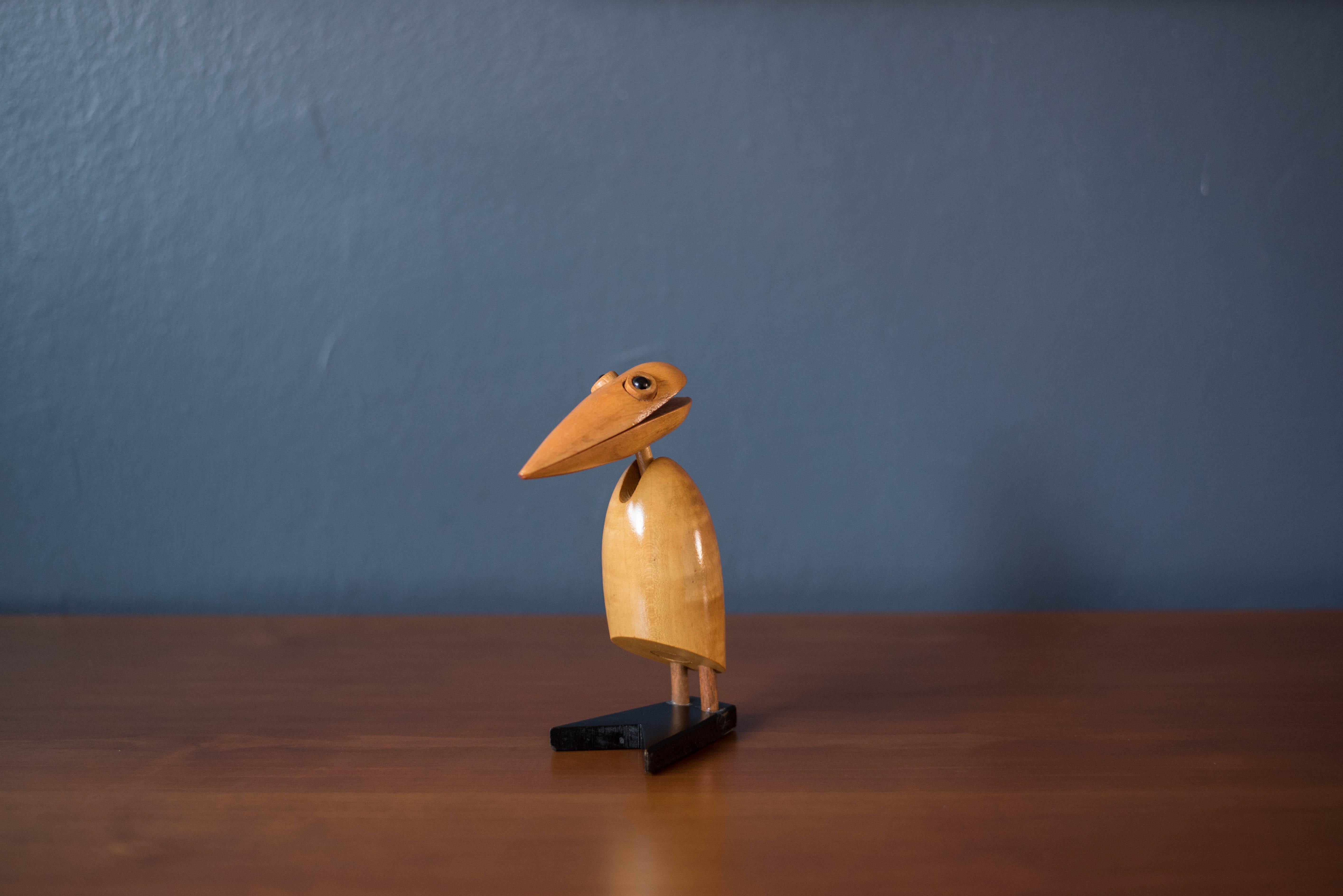 Mid-Century Modern desktop wooden dodo bird animal sculpture made in Japan, imported by Takahashi, San Francisco circa 1960's. This clever piece functions as a paper note or business card holder. A fun accessory to display in the home of office.