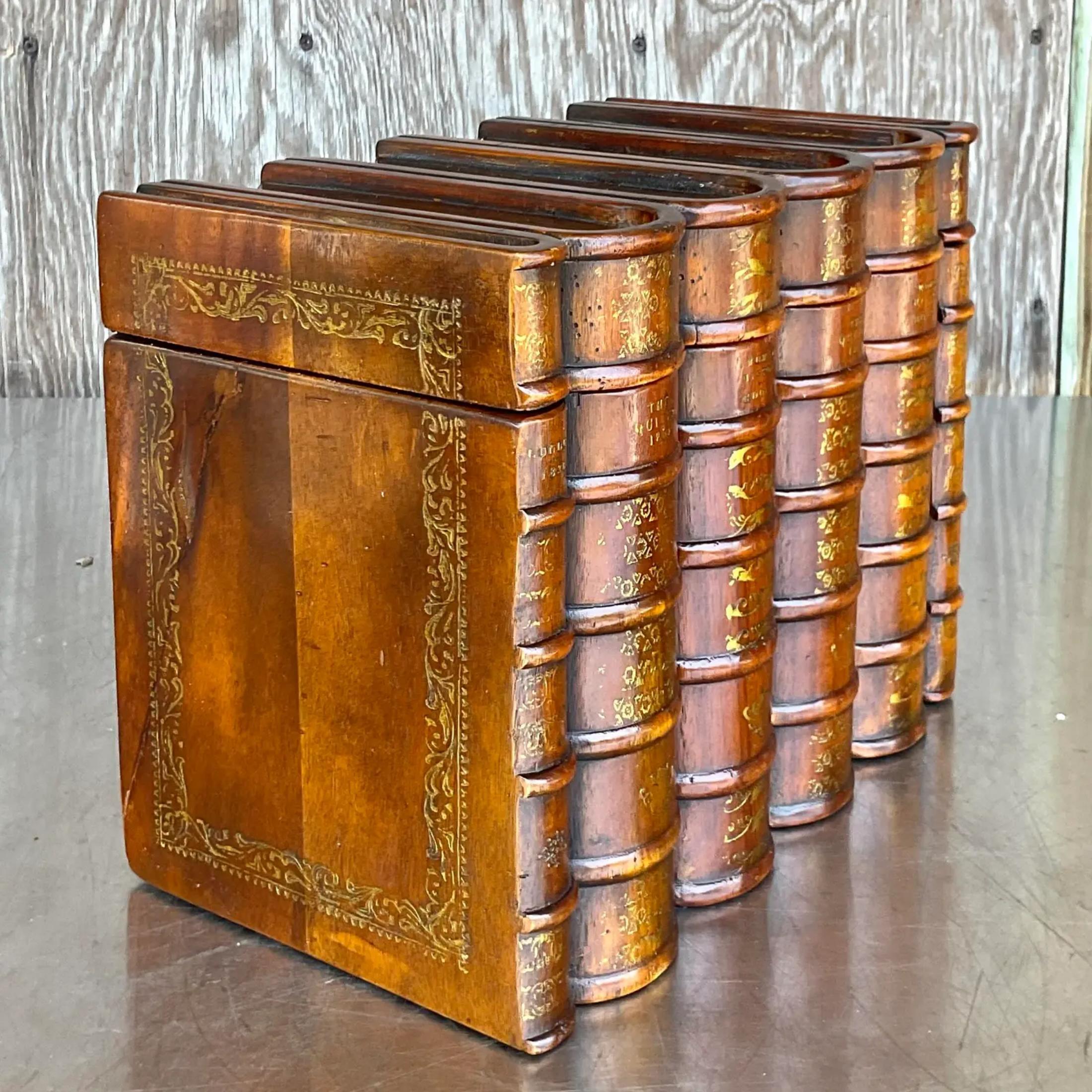A fantastic and practical vintage box that resembles faux leather bound books made out of wood. Acquired at a Palm Beach estate
