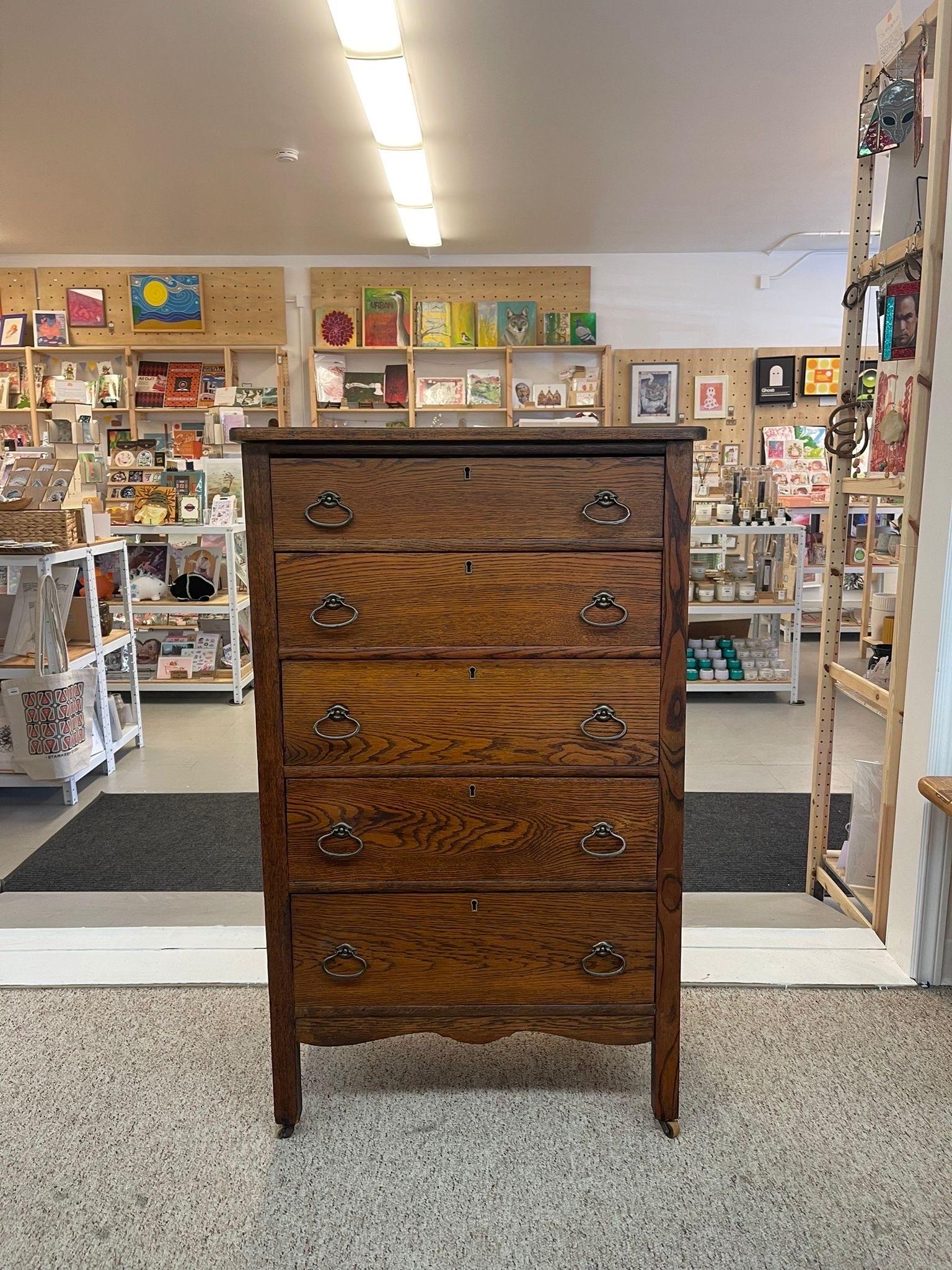 This dresser has beautiful wood grain, original hardware and rolls on casters. Dovetailed Drawers. Vintage Condition Consistent with Age as Pictured.

Dimensions. 29 W ; 18 D ; 47 H