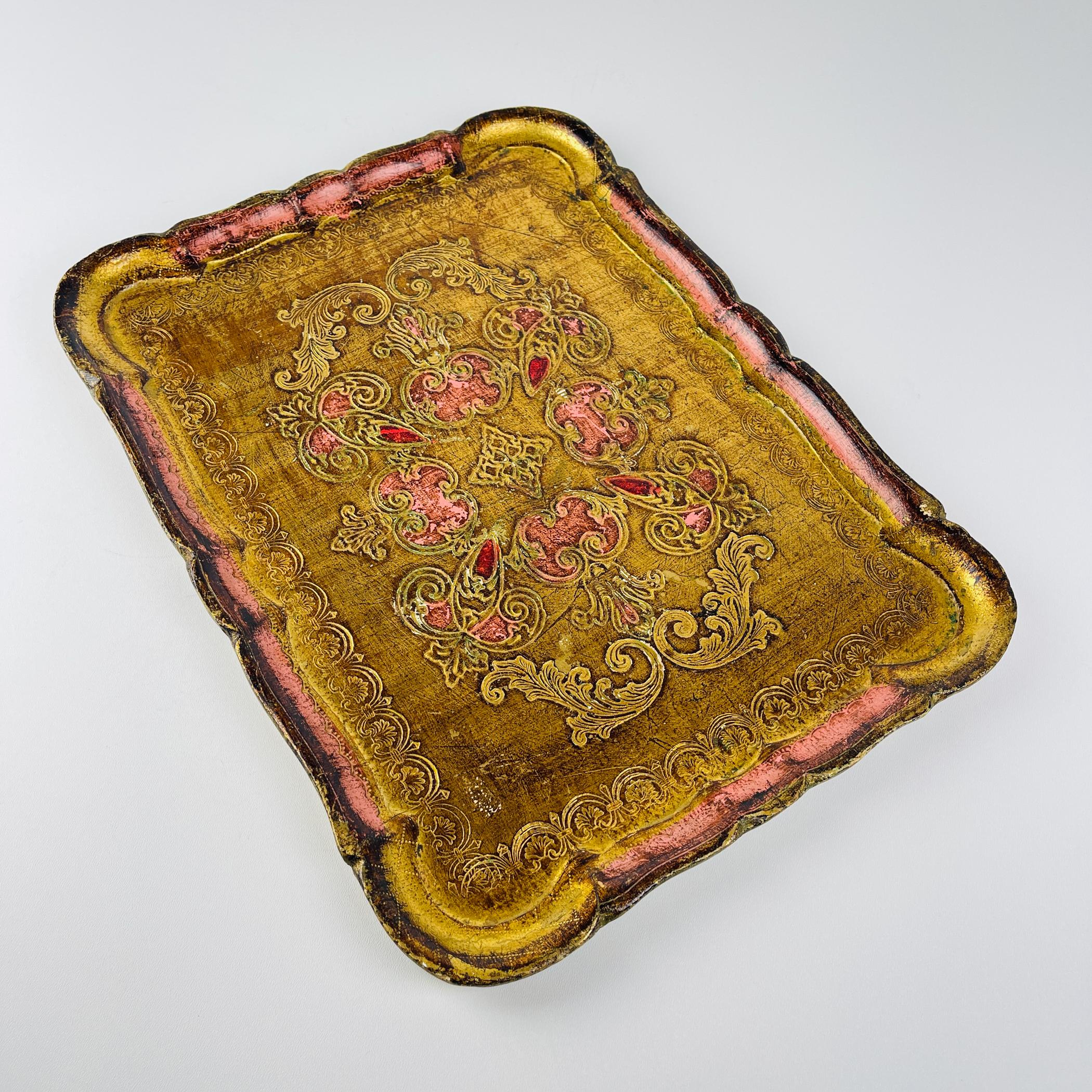 Amazing Italian Florentine tray. Manufactured in Florence, Italy. Hand-painted in gold and red shades.

Wooden tray is in a good condition with some wear due to its age.

Dimensions:
Width: 41 cm / 16.1 inches
Height: 2 cm / 0.8 inches
Depth: 31 cm