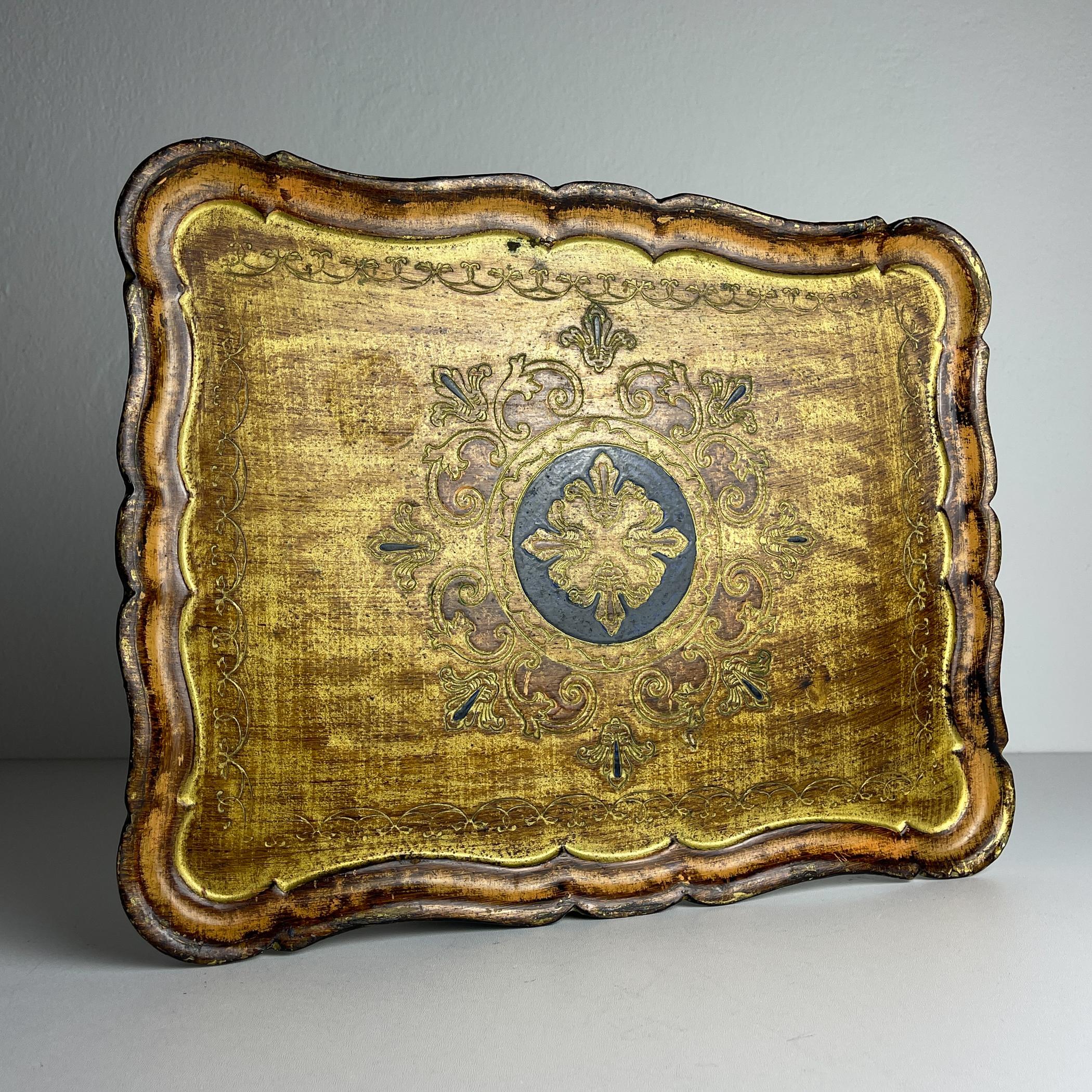 Amazing Italian Florentine tray. Manufactured in Florence, Italy. Hand-painted in gold and brown shades.

Wooden tray is in a good condition with some wear due to its age.

Dimensions:
Width: 41 cm / 16.1 inches
Height: 2 cm / 0.8 inches
Depth: 32