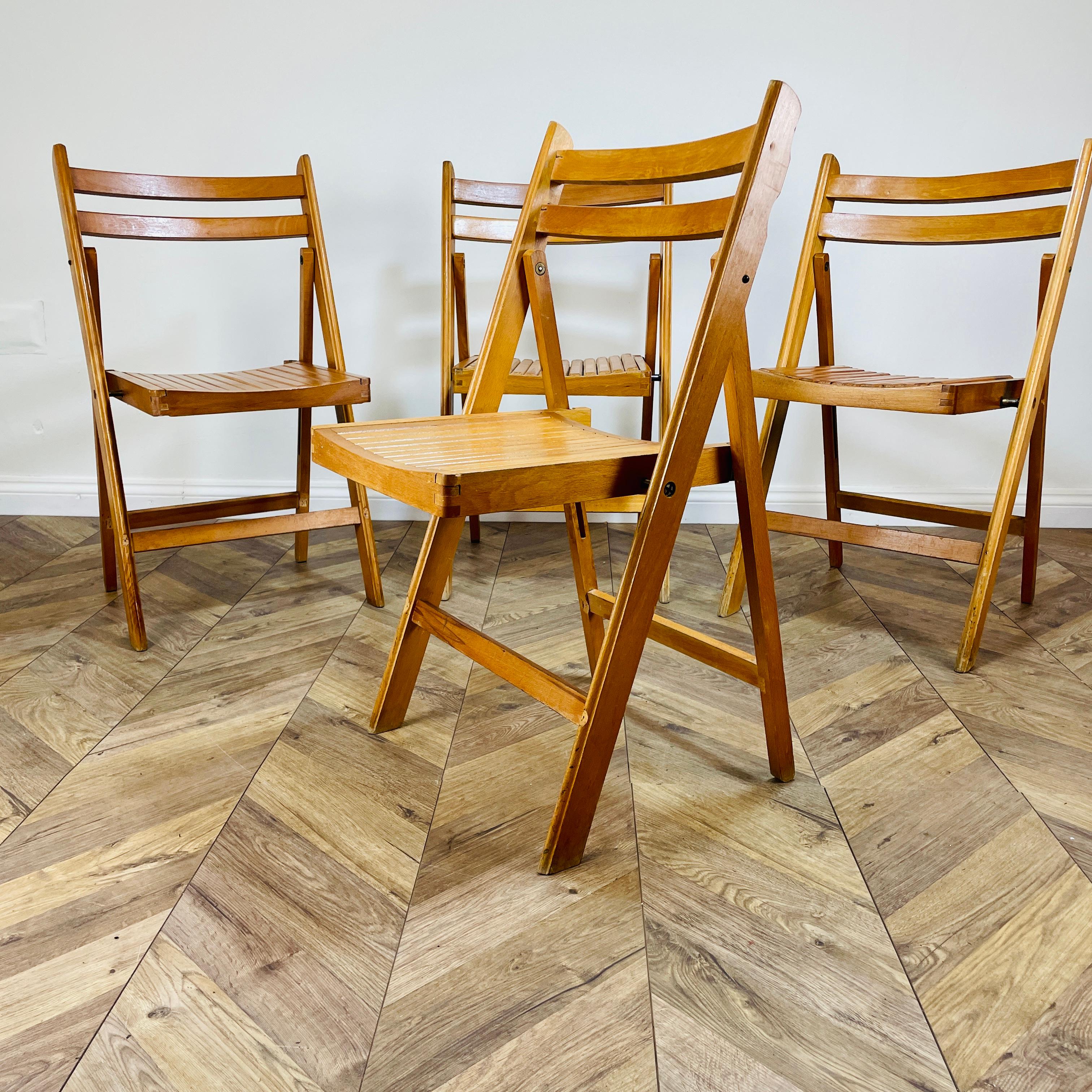 A Set of 4, midcentury Folding Chairs made by Centa in Romania, circa 1960s.

The chairs are structurally strong with slatted seats but do show signs of use with minor scuffs and marks to both frame and seats, as pictured.

.