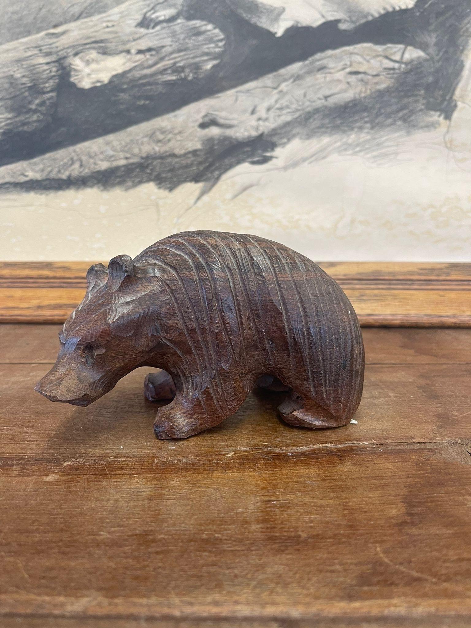 Bear Figurine with striped design and dark wood tone. Hand Carved detailing. No Makers mark. Vintage Condition Consistent with Age as Pictured.

Dimensions. 6 W ; 3 D ; 4 H