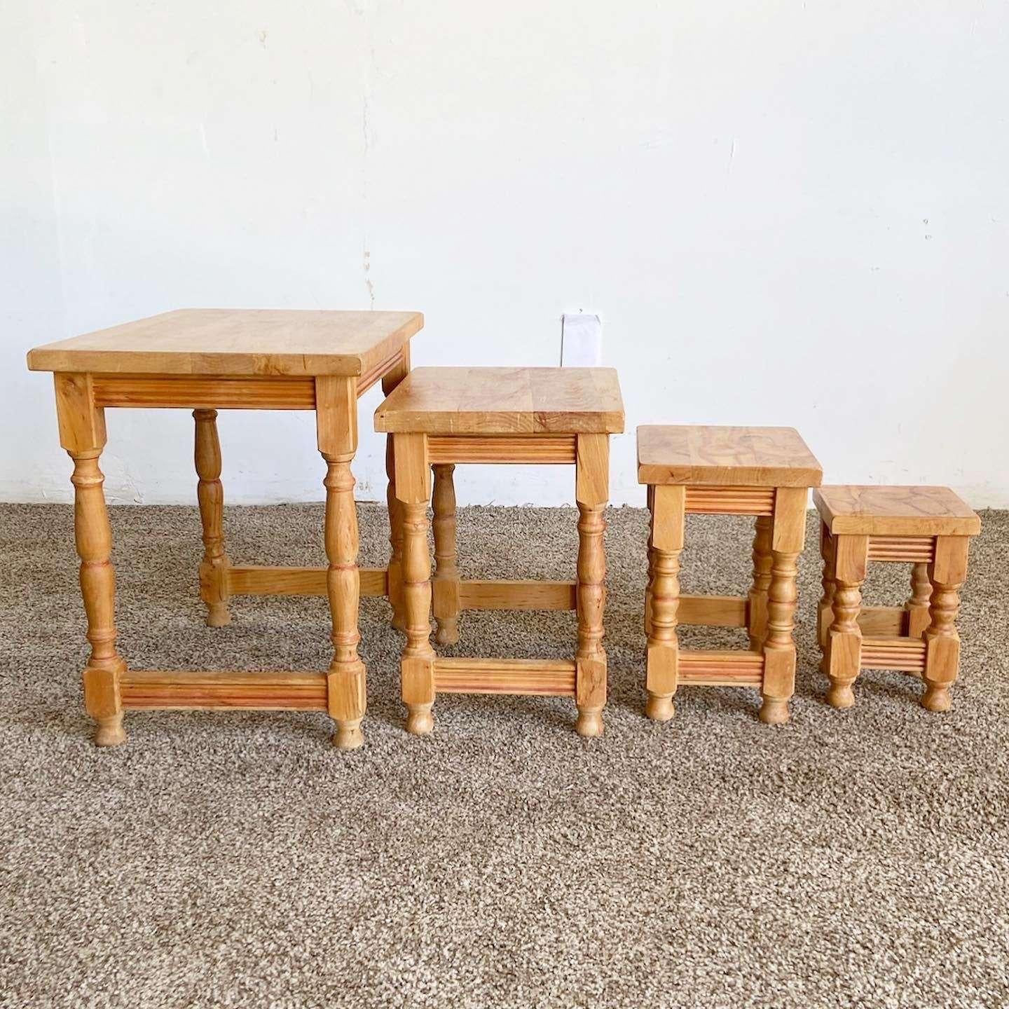 Incredible set of 4 vintage wooden nesting tables. Table base are of a traditional farmhouse style. The tops of each table display hand drawn female faces and bodies absent of clothing. Each are signed by Mordis.

Smallest measures 7.75”W,