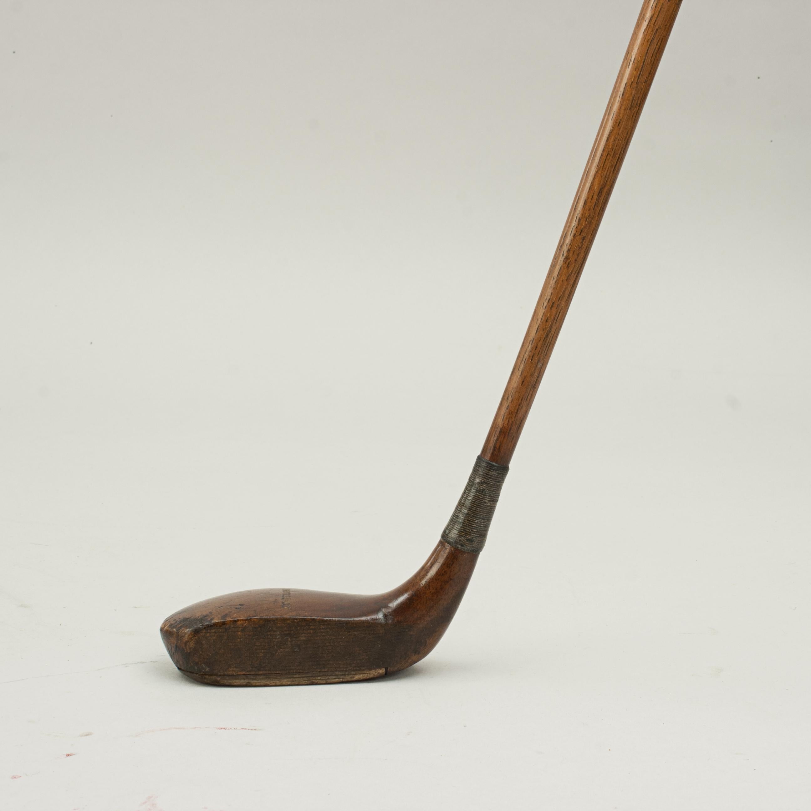Antique Auchterlonie Putter, St Andrews.
A very nice socket head putter by Auchterlonie of St Andrews. The golf club has a lead weight to the rear, traditional horn slip along the leading edge of the sole, the polished wooden head stamped