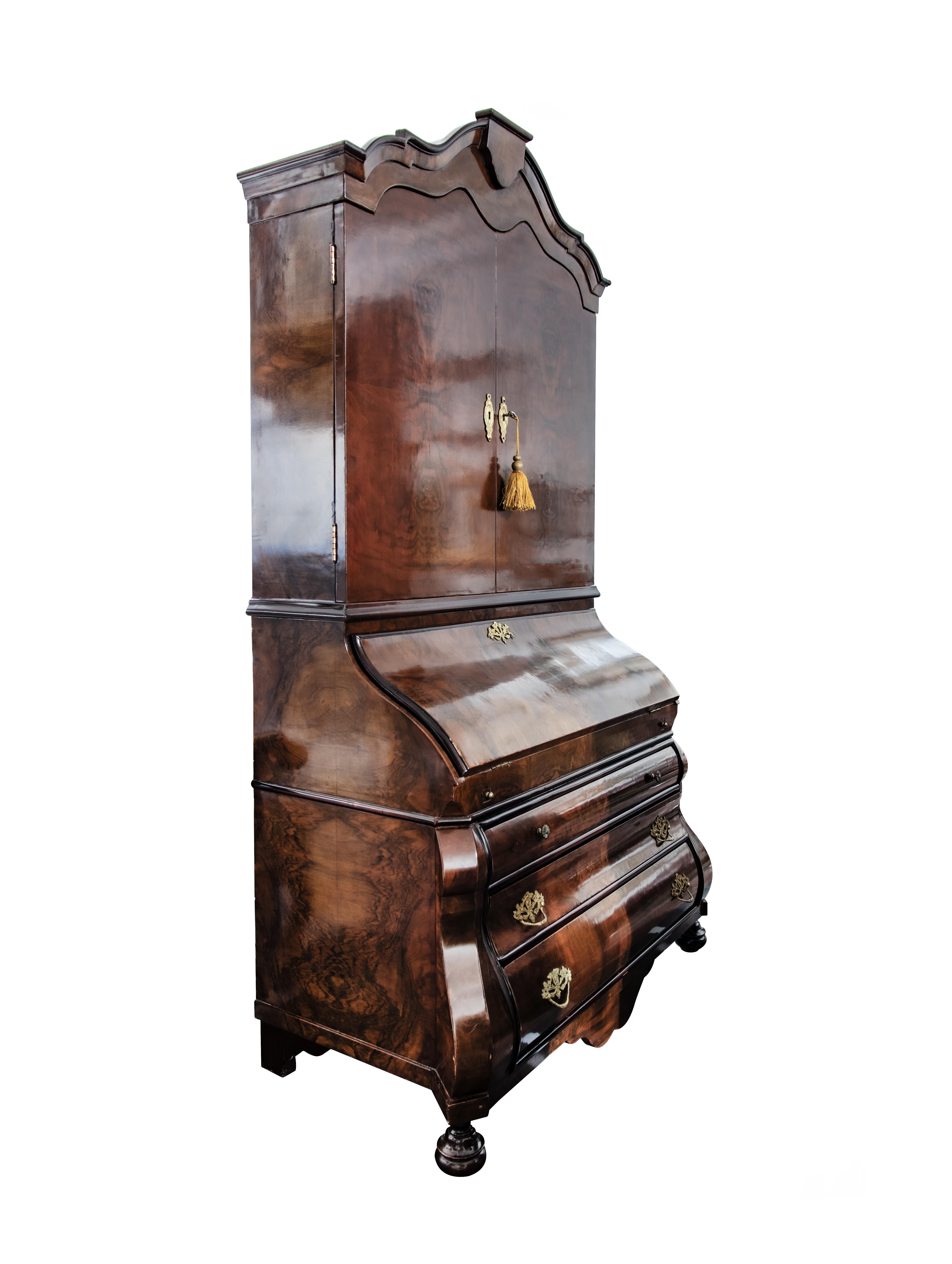 Wooden Highboard is an orginal desgn furniture item realized in Italy in the early 20th Century.

A very beautiful wood highboard with three drawers and an opening door in the higher part. Fine brass inserts that give a touch of elegant to this