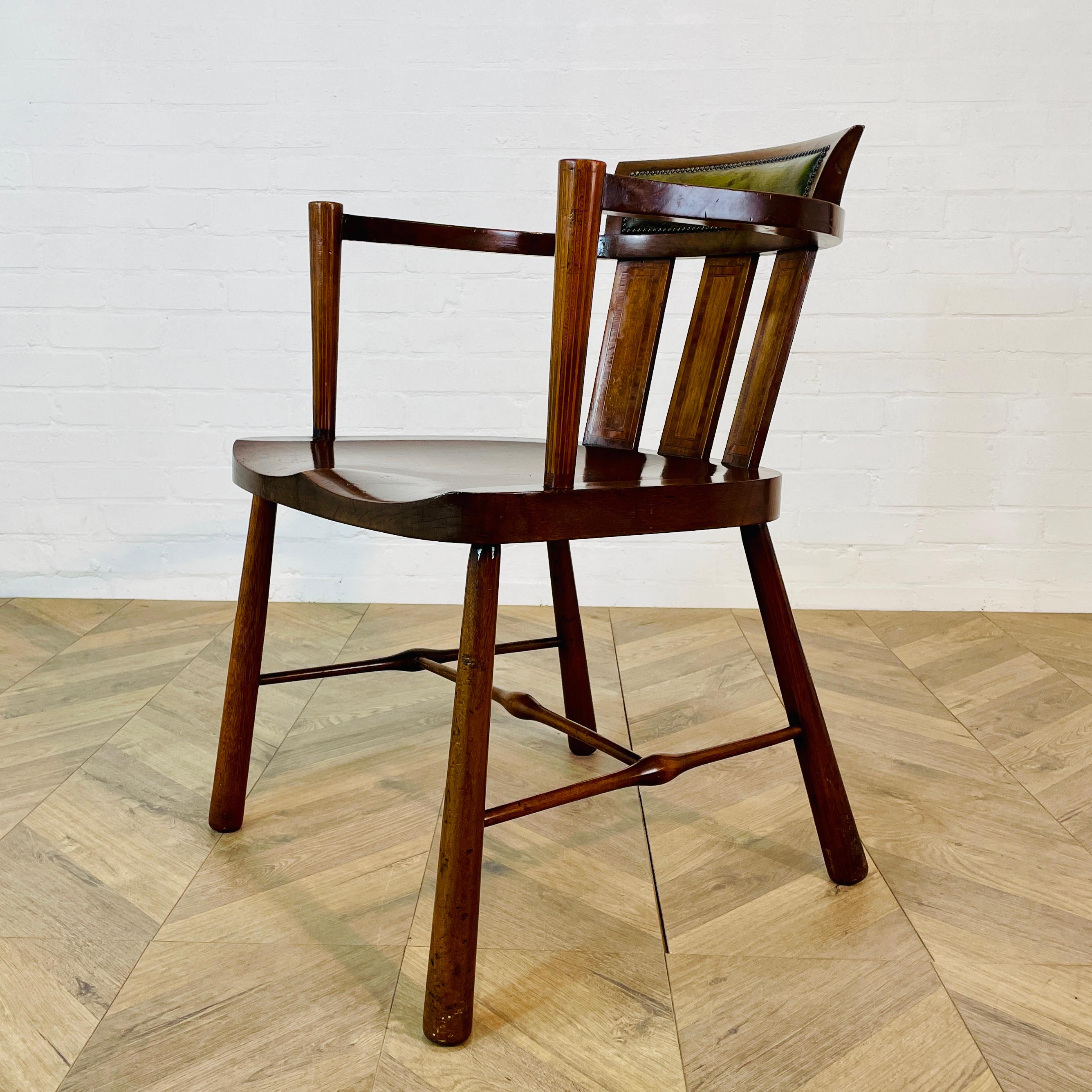 An Lovely Vintage Former Clerks Chair with Unusual Features, circa 1930s.

The chair is structurally strong and in good vintage condition, with only minor scuffs and marks, in-keeping with its age and usage. 

It features oak frame with fluted arms