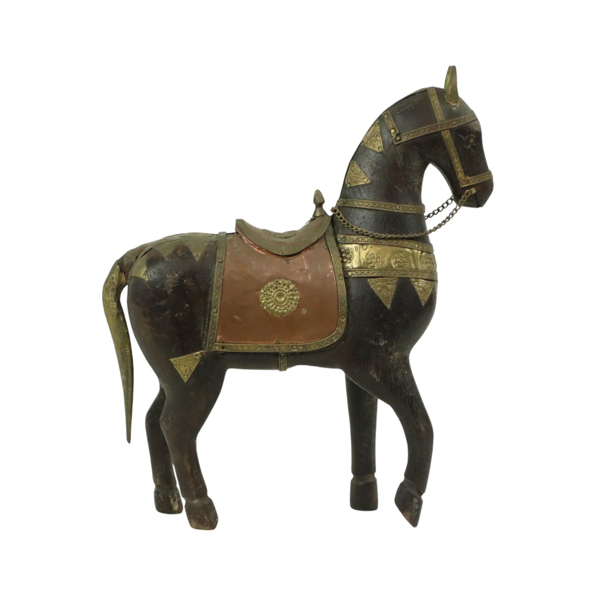Vintage wooden Marwari horse covered with red and yellow copper, or brass, characterful horse statue, sculpture, from India, mid-20th century.

This beautiful statue is handmade from hardwood and is stained black, the statue has a very beautiful age