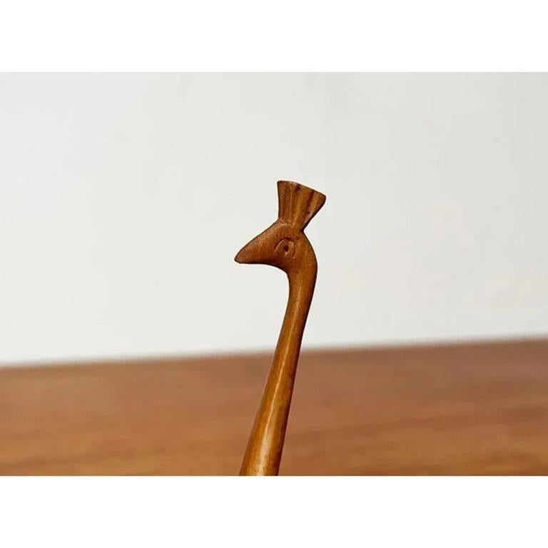 Vintage Wooden Peacock Figurine, in sehr gutem Zustand. Entworfen 1970 bis 1979.

Zusätzliche Informationen:
MATERIALIEN: Holz
Farbe: Braun
Artikel Typ: Vintage, antik oder aus Vorbesitz
Abmessungen: 2,76ʺB × 1,57ʺD × 5,51ʺH
Zustand: Einige