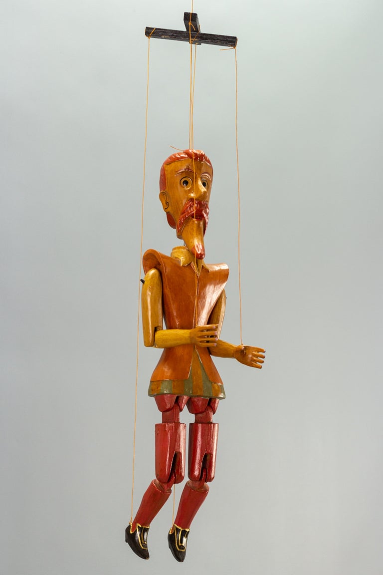 An adorable vintage wooden puppet marionette - Don Quixote. 
The marionette is operated by 5 strings by a wooden controller. 
Dimensions of the figure: height: 51 cm / 20.07 in; width: 17 cm / 6.7 in; depth: 8 cm / 3.15 in.