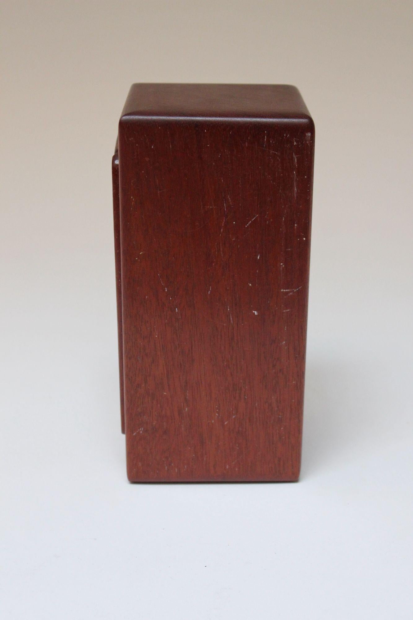 Hand-Carved puzzle box composed of miniature seats and tables all ingeniously stacked and nestled into the rectangular holder that doubles as a table itself.
Includes a variety of chair and table sizes, as shown.
There are some scuffs and spots to